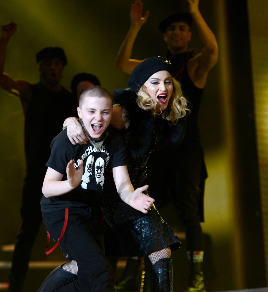 Rocco Ritchie and Madonna on stage during her "MDNA" tour in 2012 in Tel Aviv, Israel | Source: Getty Images