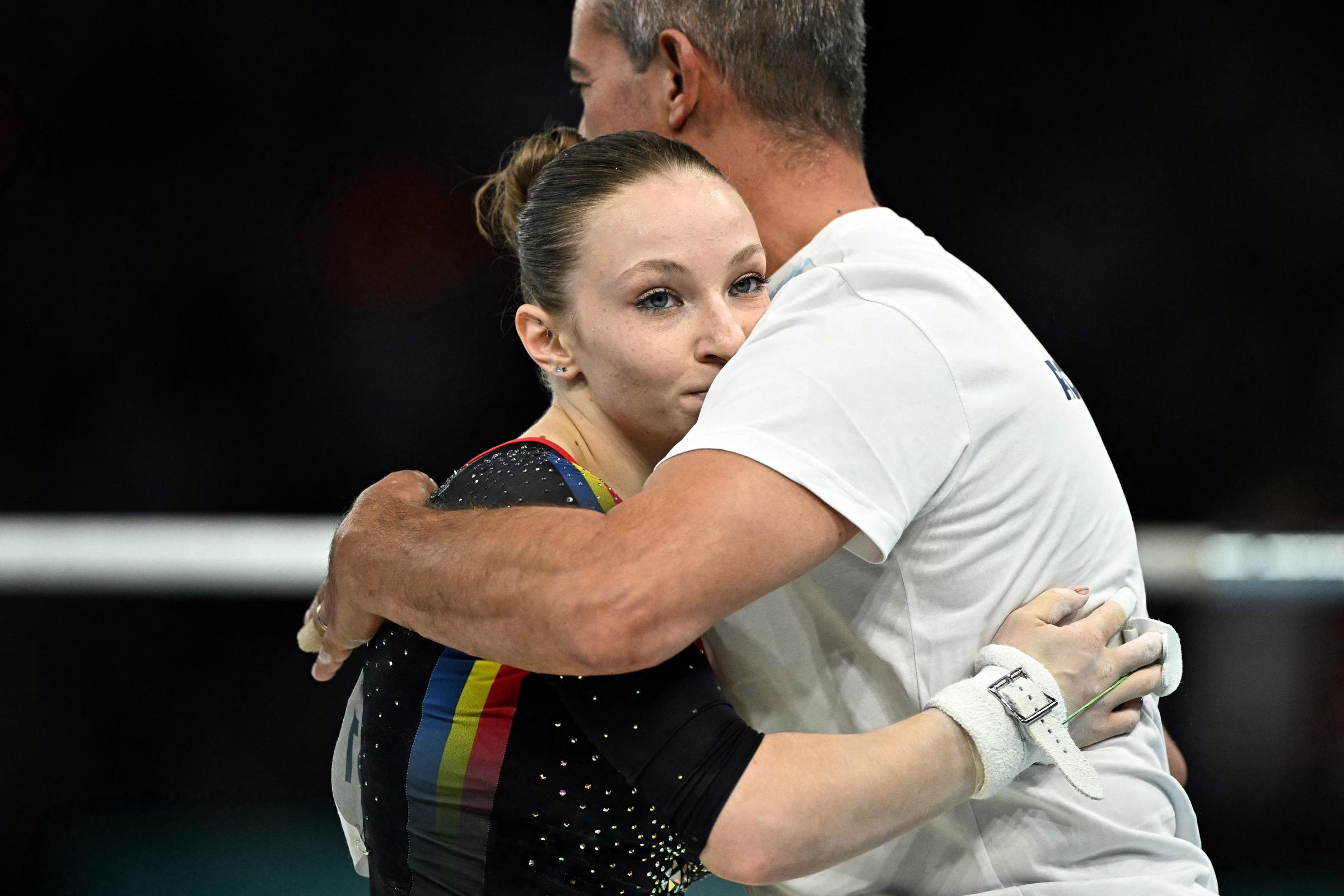 Ana Barbosu hugs her coach after competing in the uneven bars event of the women's artistic gymnastics qualification at the Paris 2024 Olympics on July 28, 2024 | Source: Getty Images