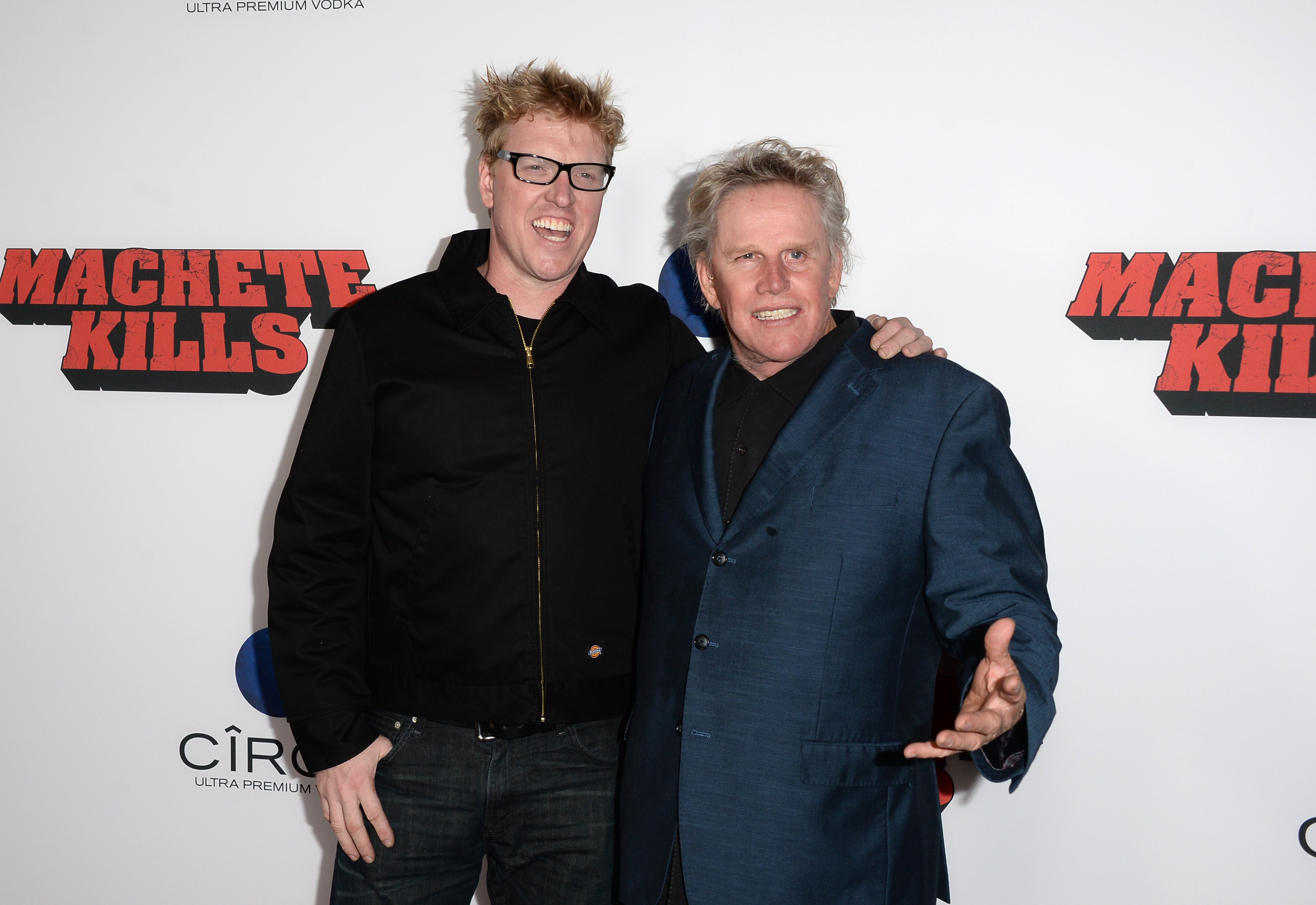 Jake and Gary Busey arrive at the premiere of Open Road Films' "Machete Kills" at Regal Cinemas L.A. Live on October 2, 2013, in Los Angeles, California. | Source: Getty Images