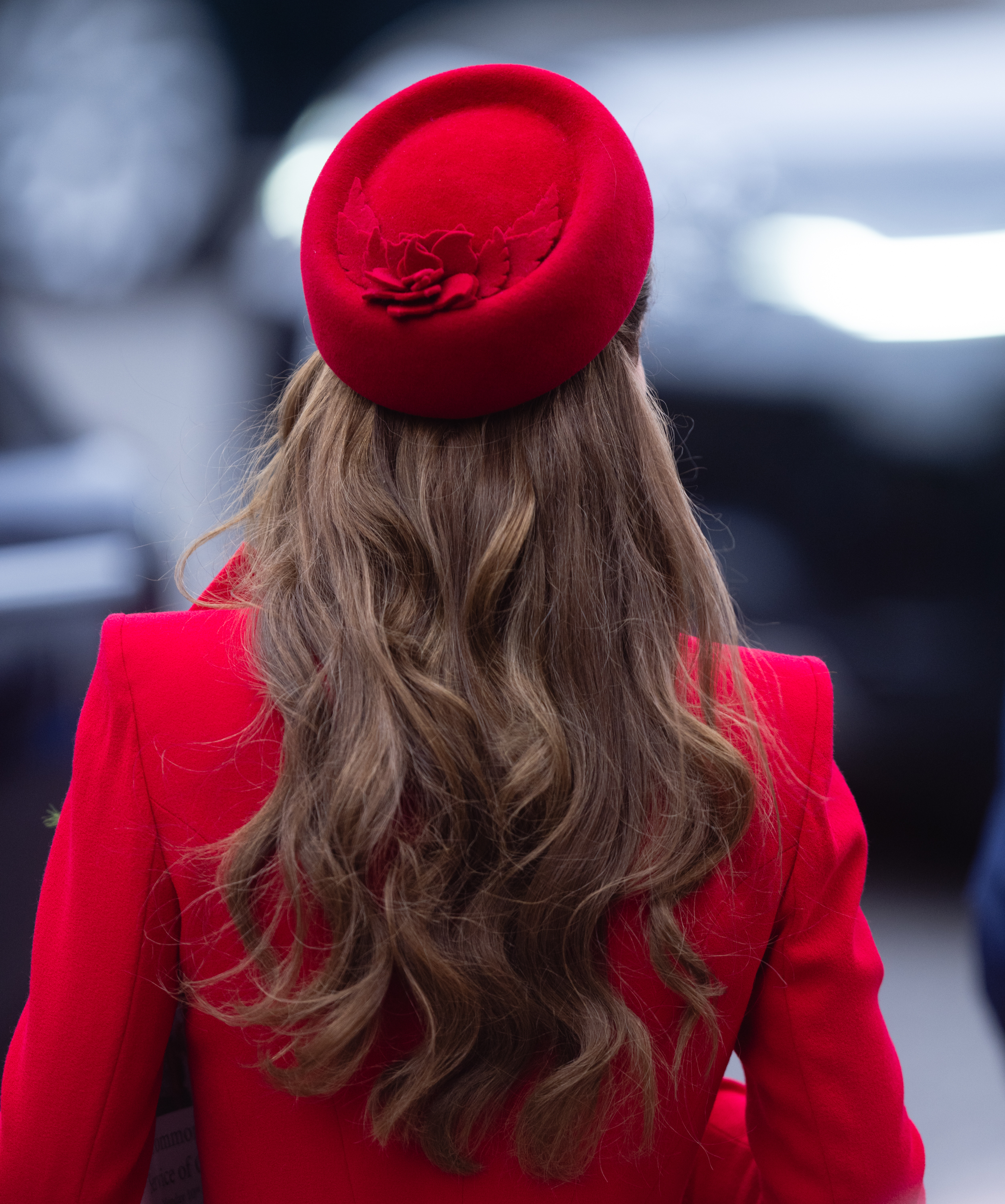 A back-view shot of Princess Catherine's red coatdress and matching pillbox hat during her attendance at the Commonwealth Day celebration at Westminster Abbey | Source: Getty Images