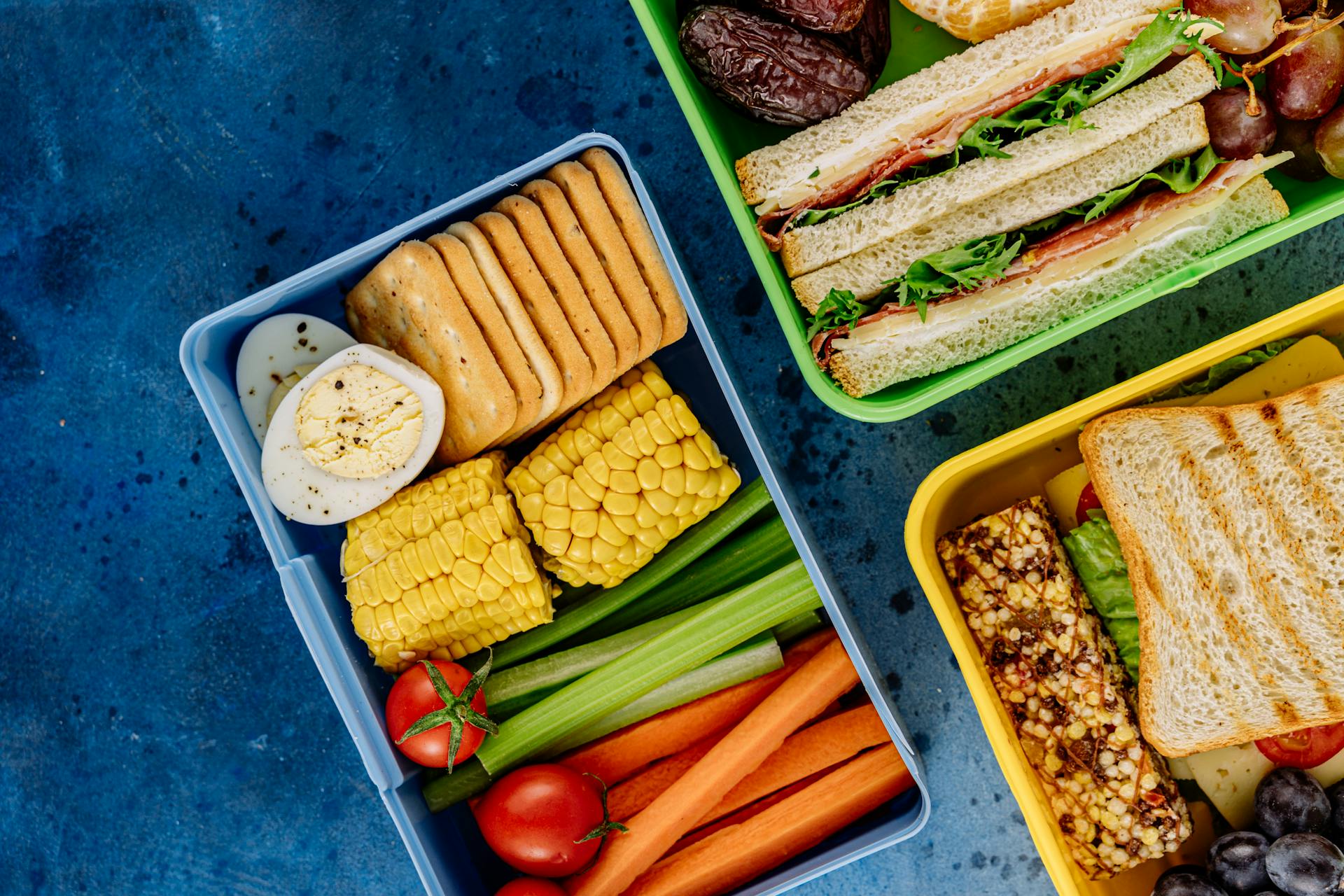 Neatly packed lunchboxes filled with healthy food options | Source: Pexels