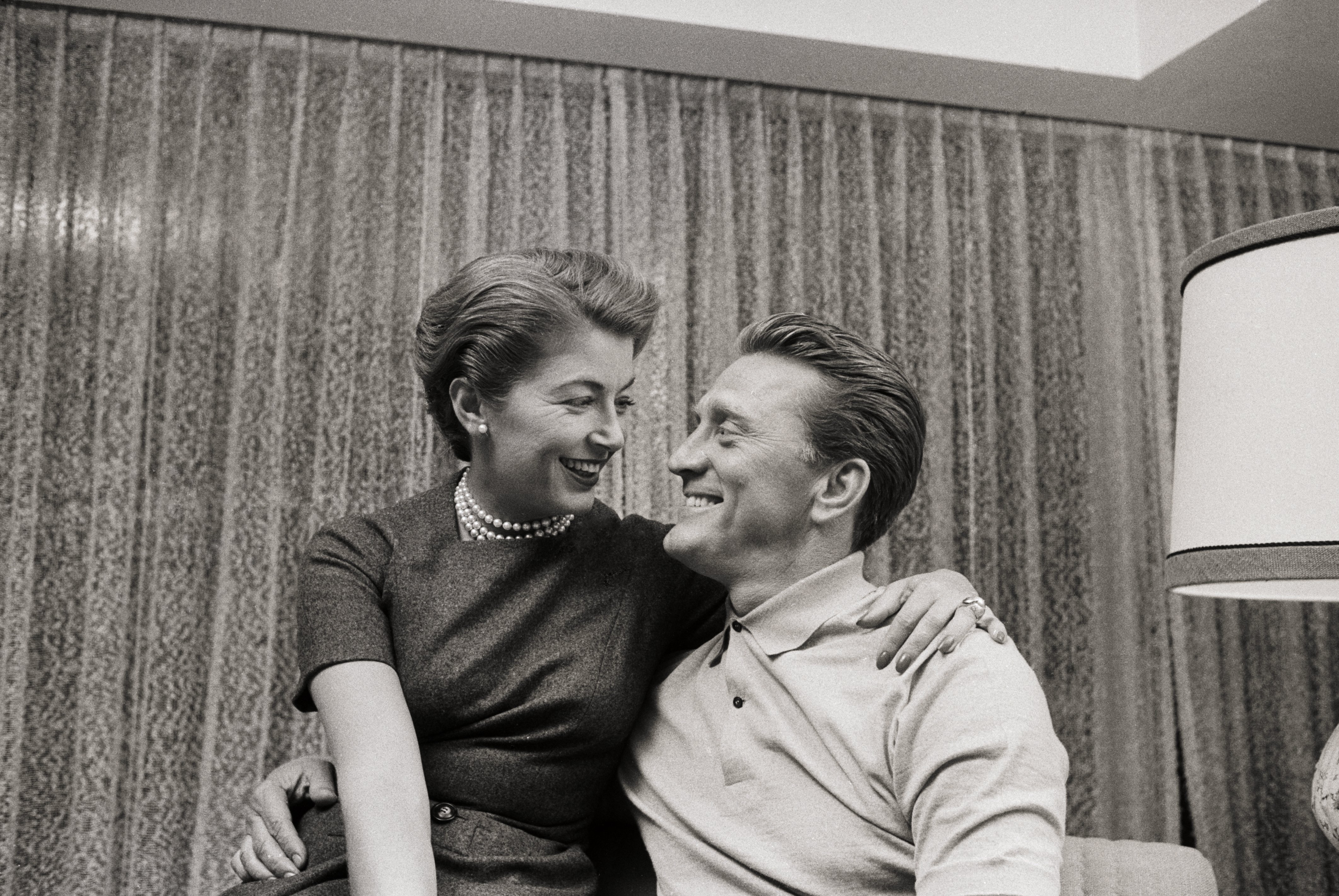 Kirk Douglas and his spouse Anne Douglas gaze at each other while smiling following his nomination for an Academy Award on February 18 | Photo: Getty Images