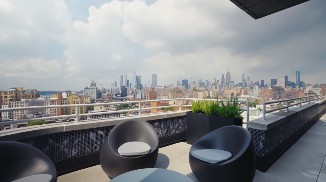 Christopher openly described himself as a "view freak," and this terrace makes it easy to see why. The family's prized panorama places the West Village and Manhattan skyline almost directly at their feet. | Source: YouTube/Architectural Digest
