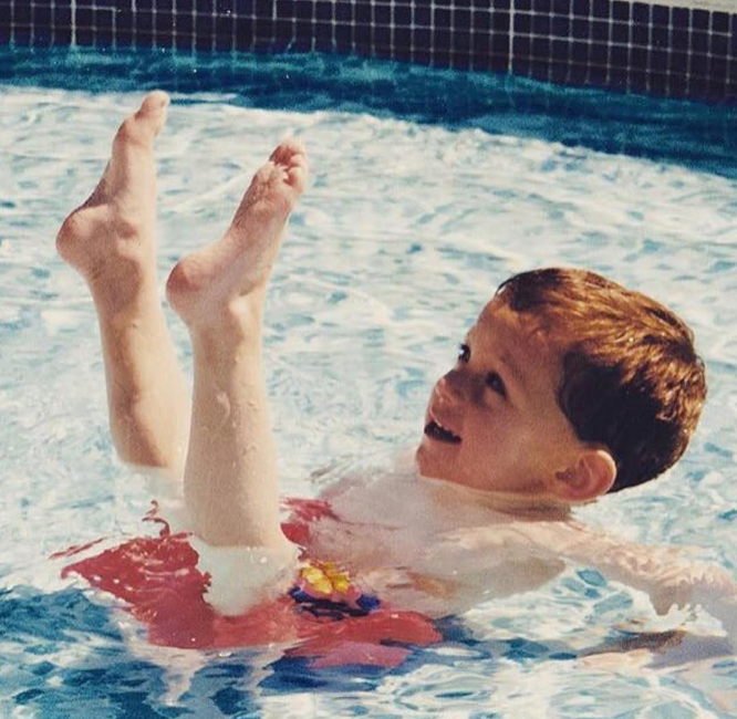 Although it took work, it was clear that he was meant for acrobatics from an early age. In this photo, he posed as a child in a pool in a throwback image uploaded on July 11, 2017. | Source: Instagram/tomholland2013