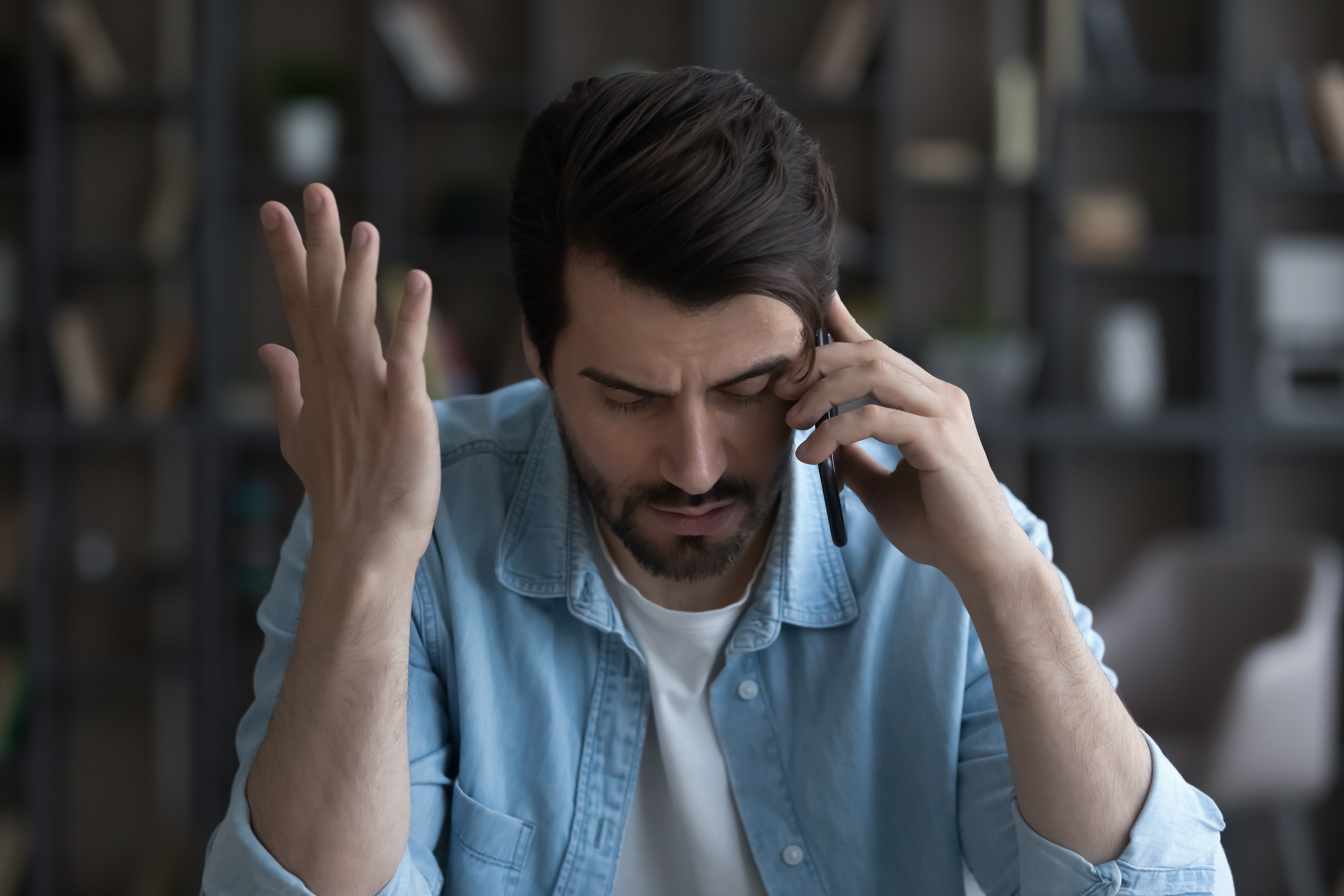 A man talking on his phone | Source: Shutterstock