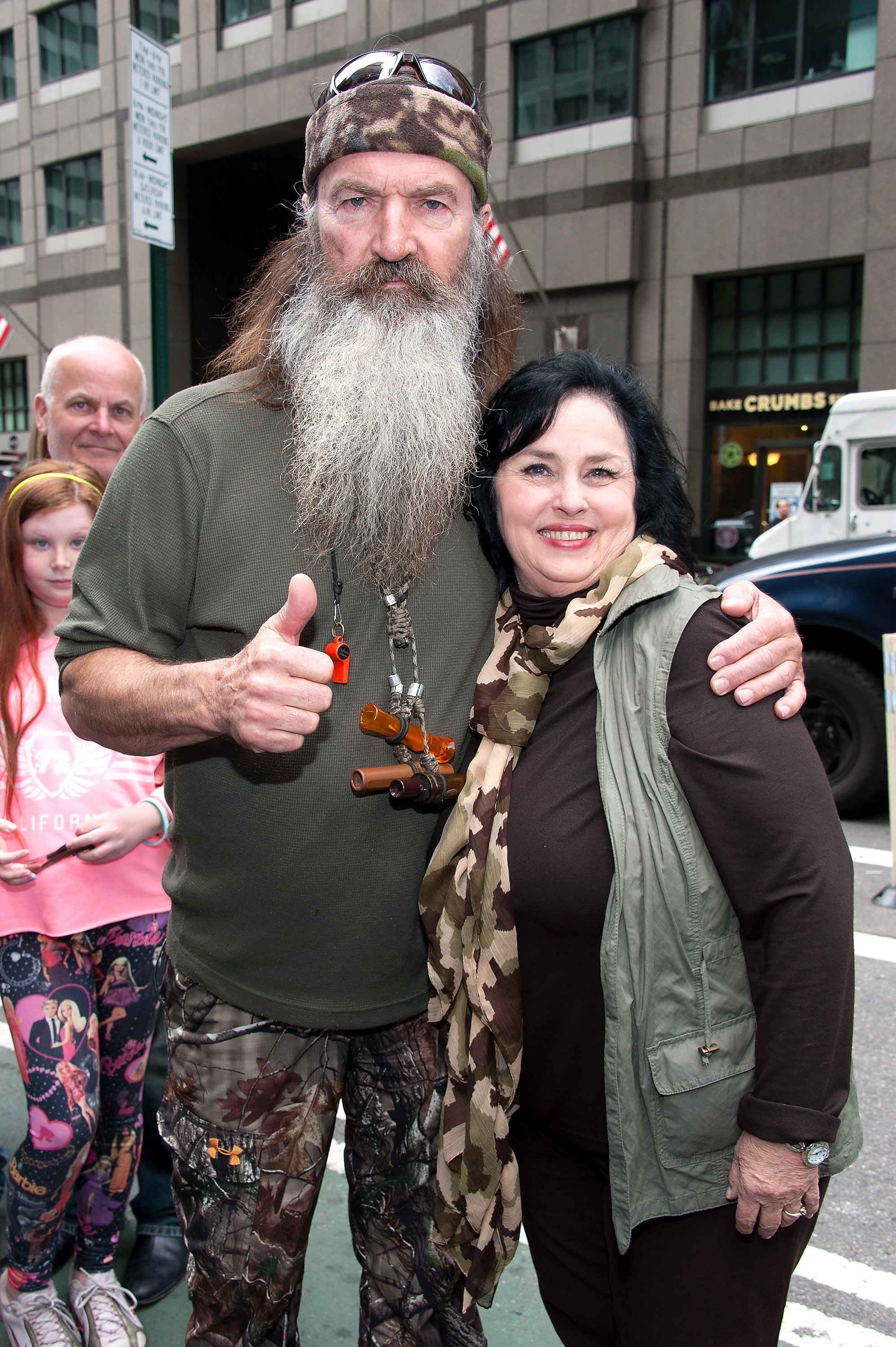 Phil and Kay Robertson visit "Extra" in Times Square on May 7, 2013, in New York City. | Source: Getty Images