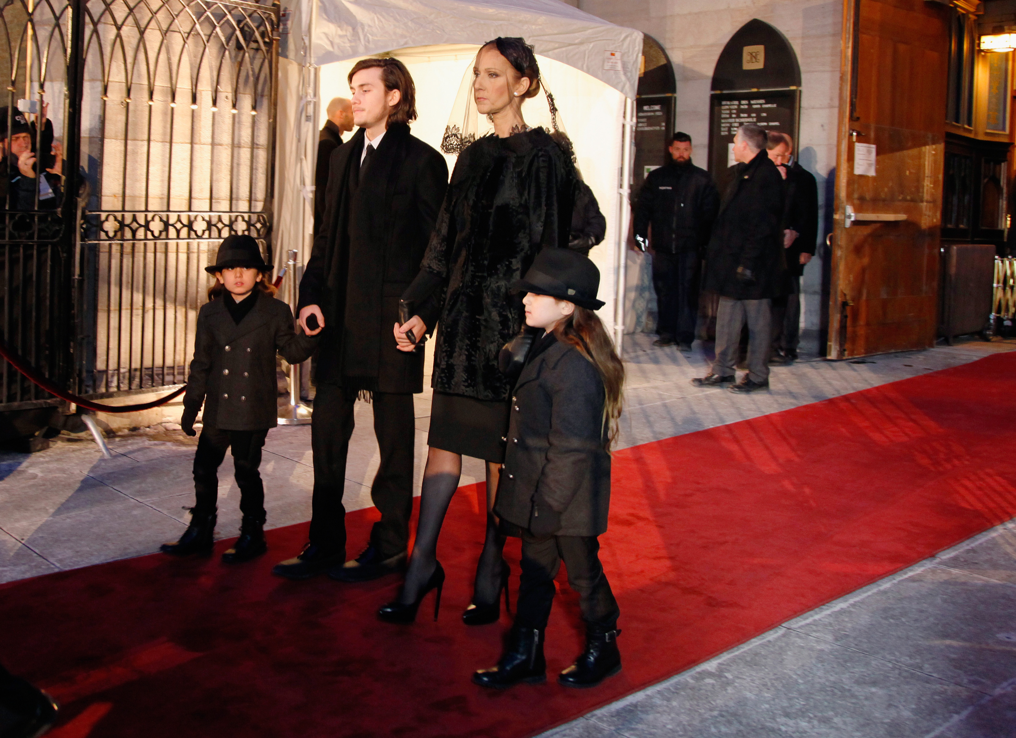 Celine Dion and children Rene-Charles Angelil, Eddy Angelil and Nelson Angelil attend the state funeral service for Rene Angelil at Notre-Dame Basilica on January 22, 2016 in Montreal, Canada. | Source: Getty Images