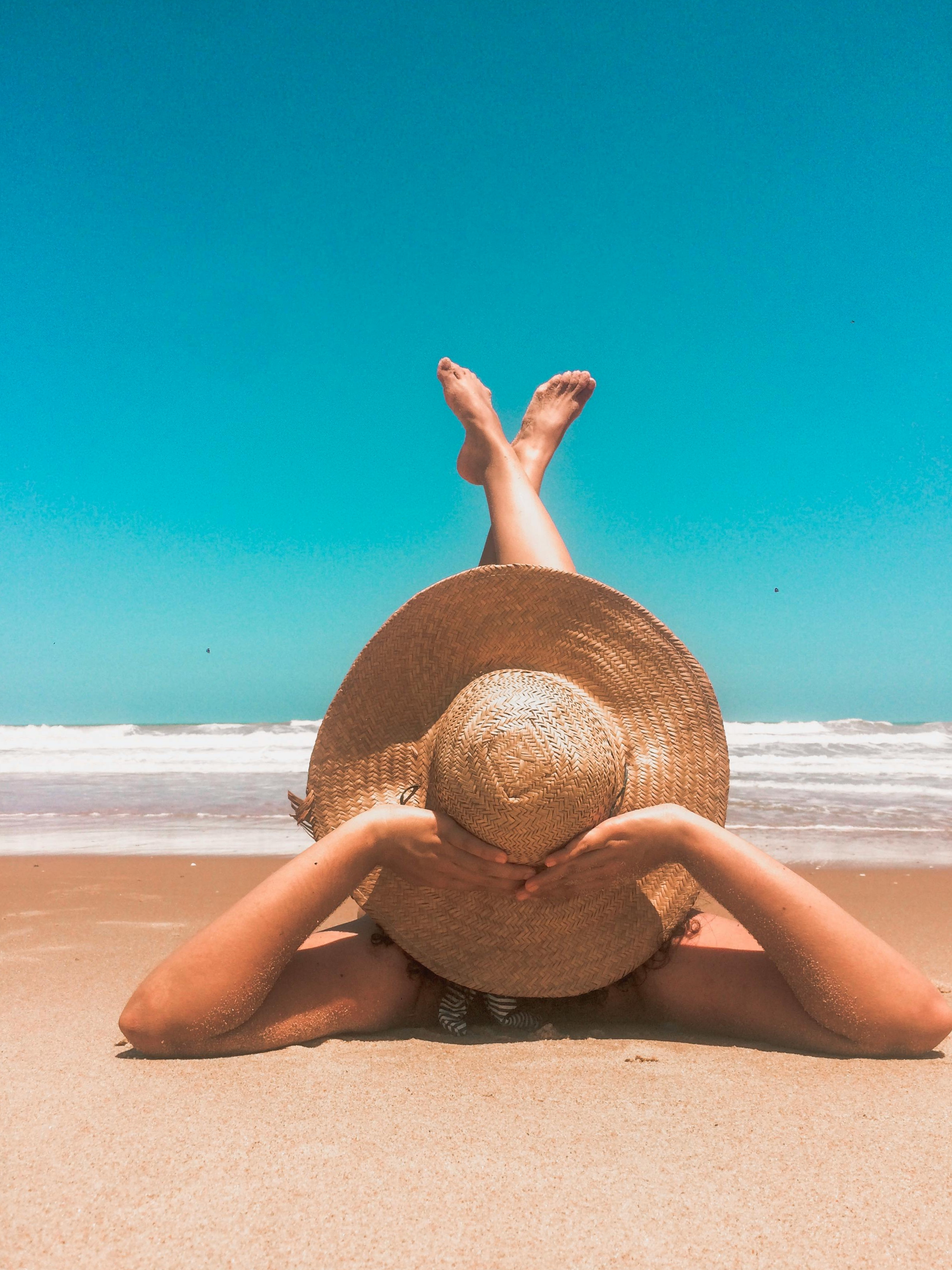 A woman lounging on a beach | Source: Pexels