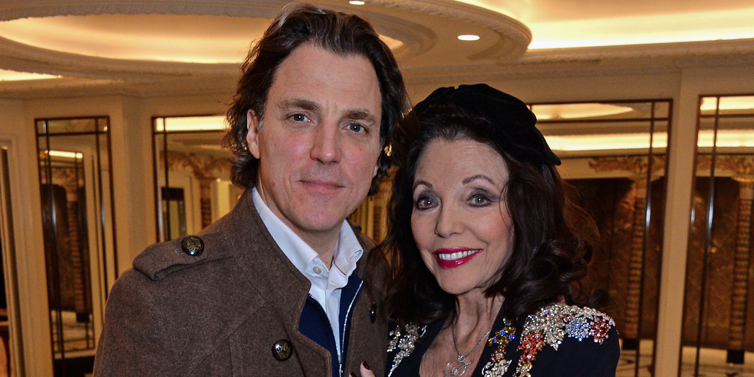 Joan Collins and Alexander Newley | Source: Getty Images