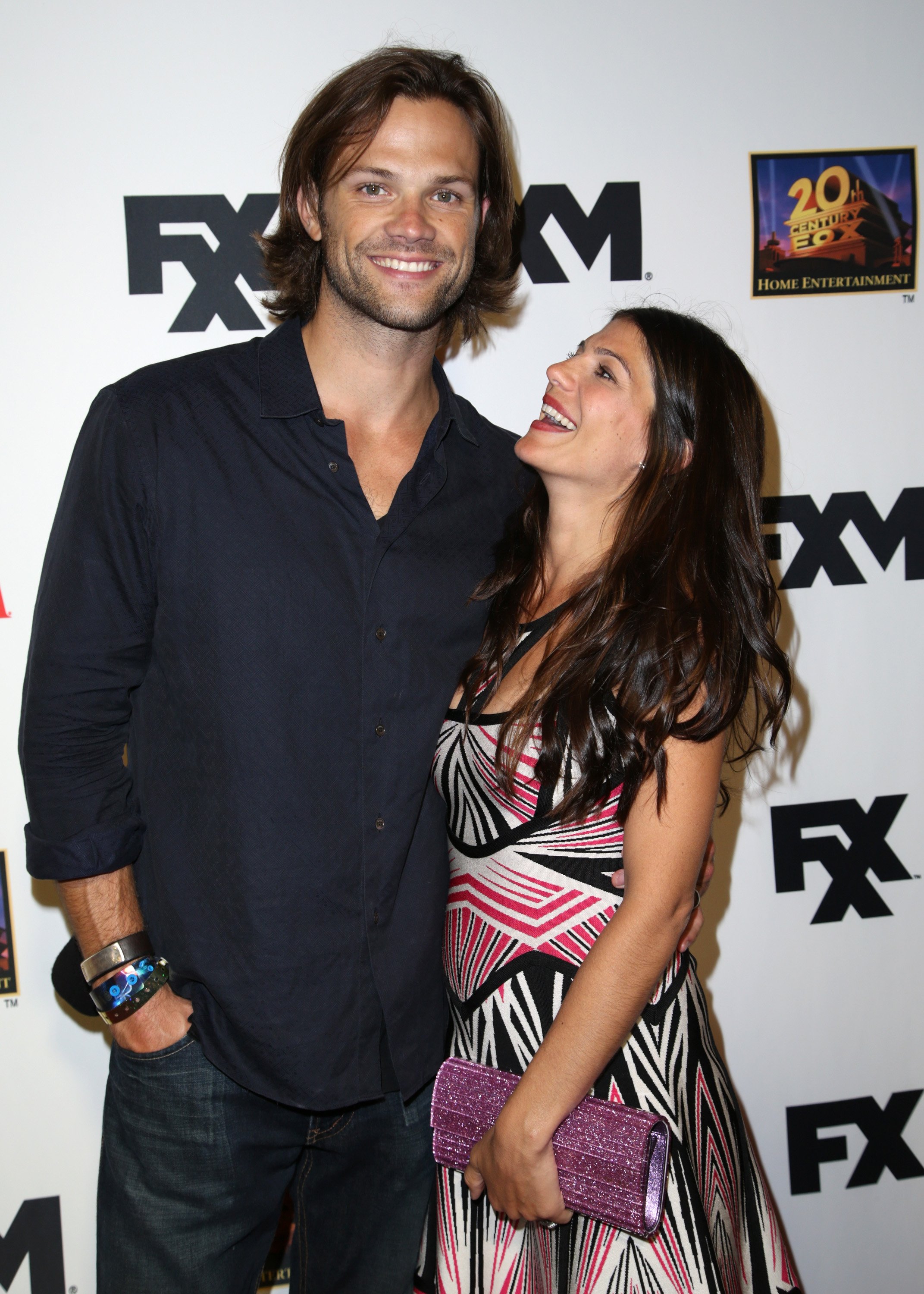 Jared Padalecki and his wife Genevieve Padalecki at the Maxim, FX, and Home Entertainment Comic-Con Party on July 19, 2013, in San Diego, California. | Source: Getty Images