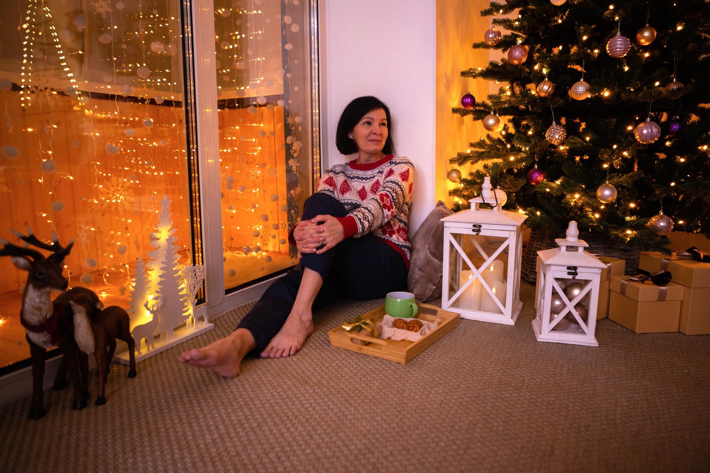 Woman enjoying a quiet Christmas alone | Source: Shutterstock