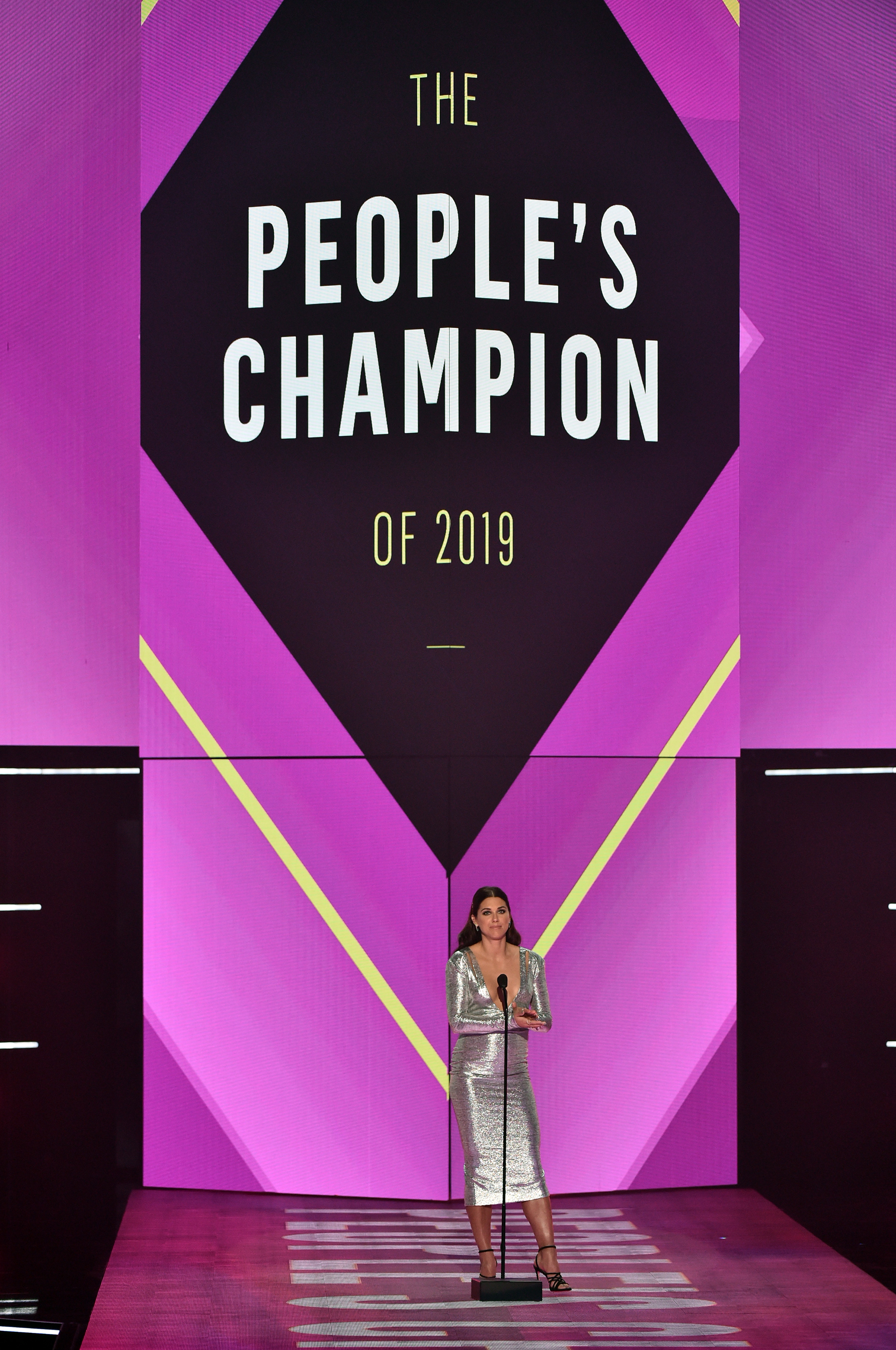 Alex Morgan speaks on stage during the 2019 E! People's Choice Awards held at the Barker Hangar, on November 10, 2019. | Source: Getty Images