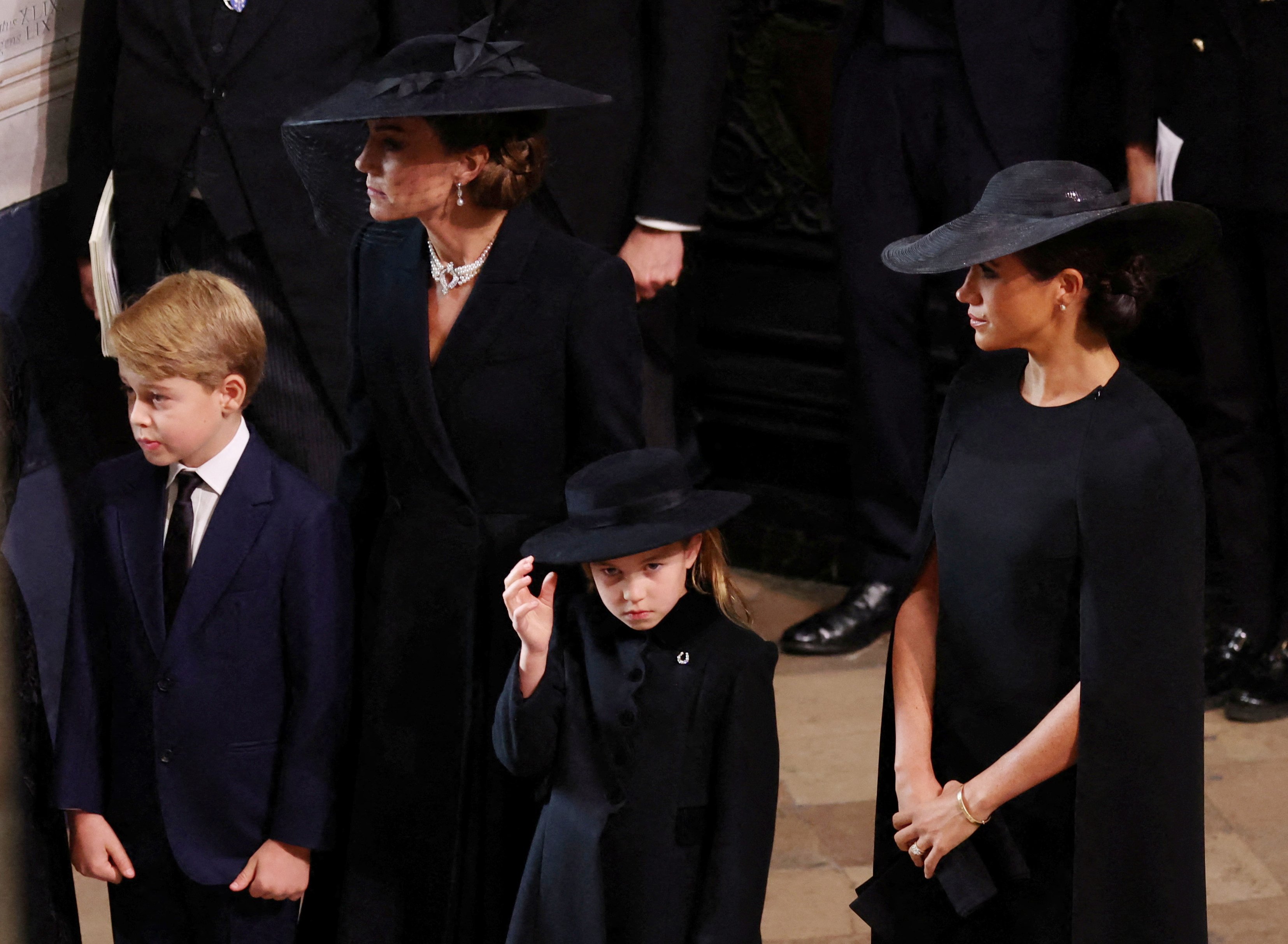 Catherine, Princess of Wales, Princess, Prince George and Meghan, arrive at Westminster Abbey for the State Funeral of Queen Elizabeth II on September 19, 2022 in London, England. | Source: Getty Images
