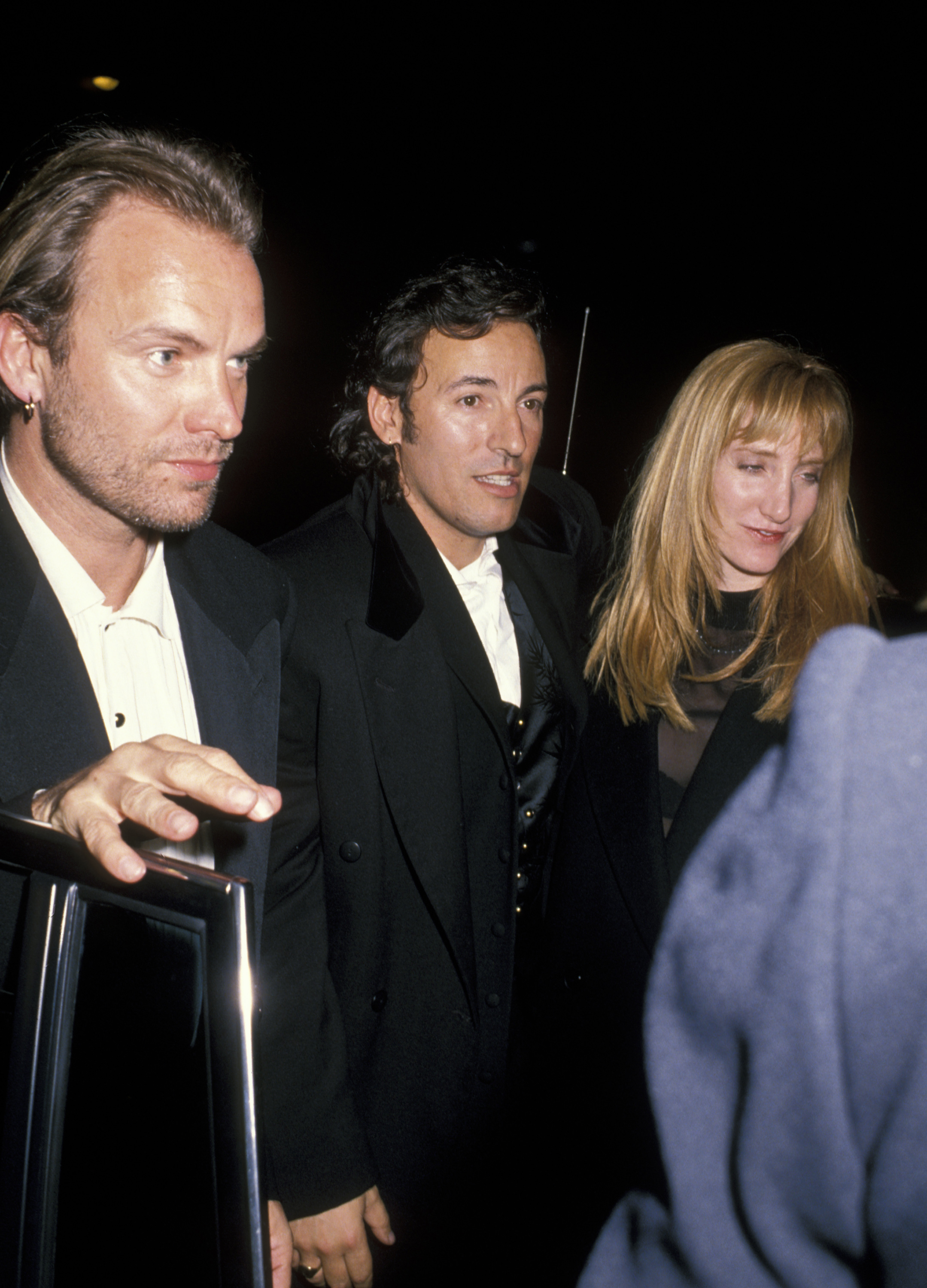 In this 1990 photo from the 5th Annual Rock and Roll Hall of Fame Awards, Sting stands alongside Bruce Springsteen and Patti Scialfa. The trio appear relaxed and united. The image reflects the early days of a friendship that would span decades.
