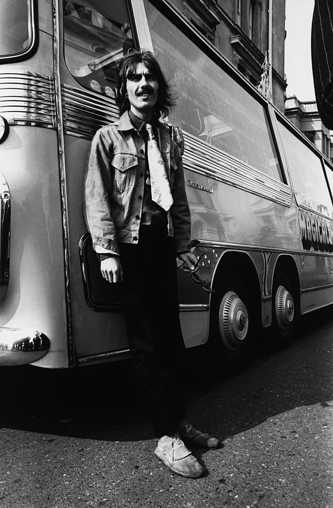 George Harrison (1943 - 2001) of the Beatles leaves the bus in Plymouth during the location filming of 'Magical Mystery Tour', 1967. | Getty Images / Global Images Ukraine George Harrison (1943 - 2001) of the Beatles leaves the bus in Plymouth during the location filming of 'Magical Mystery Tour', 1967. | Getty Images / Global Images Ukraine