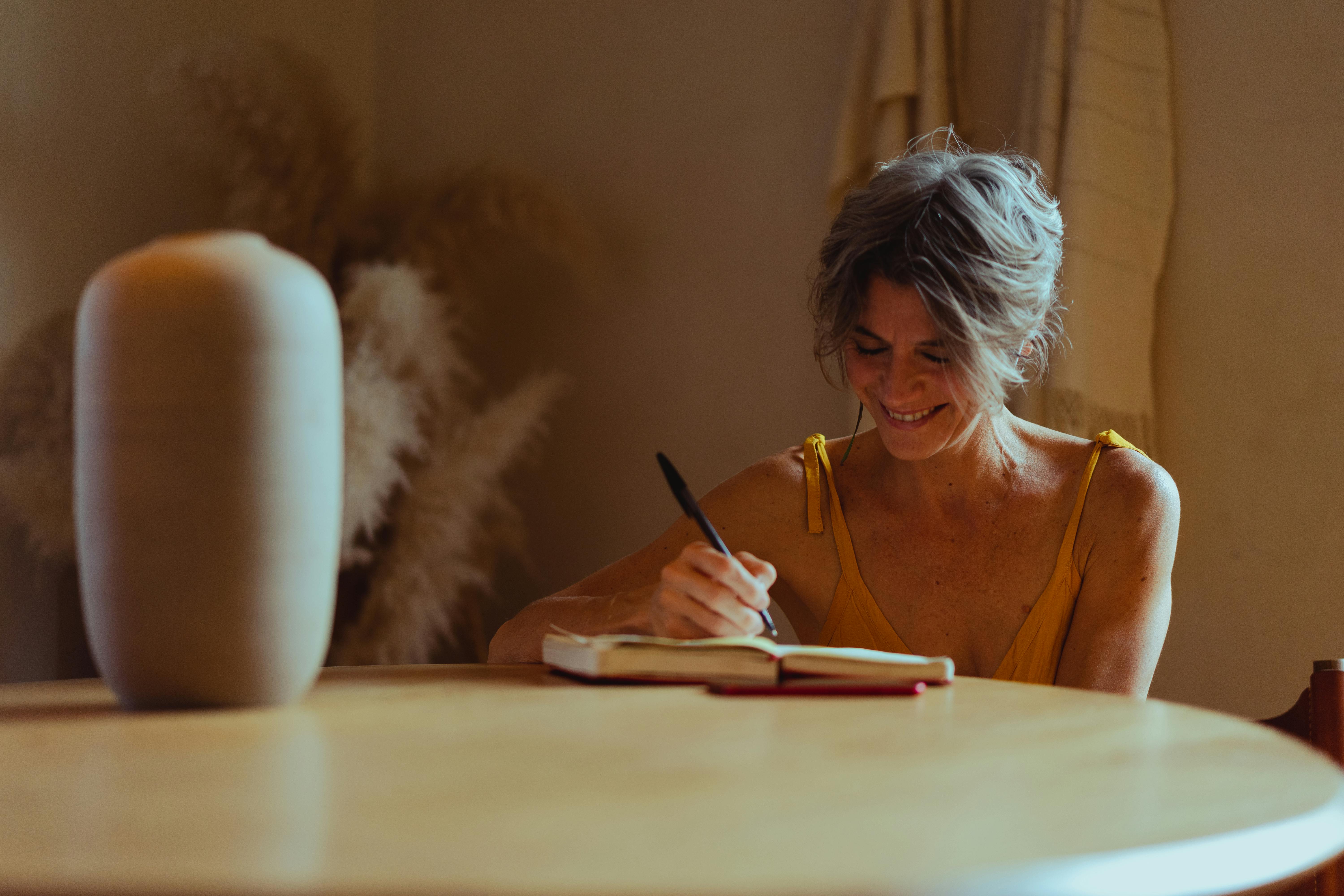 Woman journaling | Source: Pexels