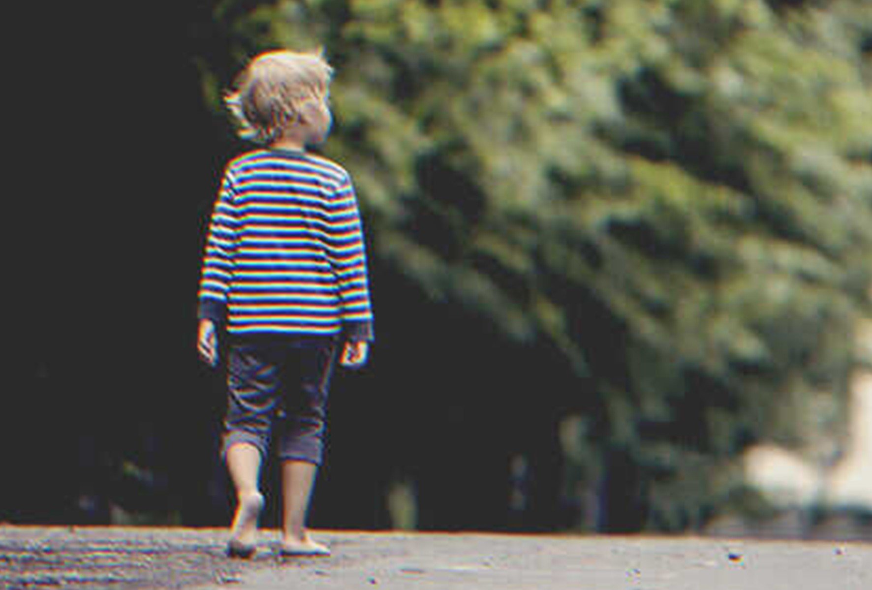 There was a barefoot boy by the side of the road. | Source: Shutterstock.com