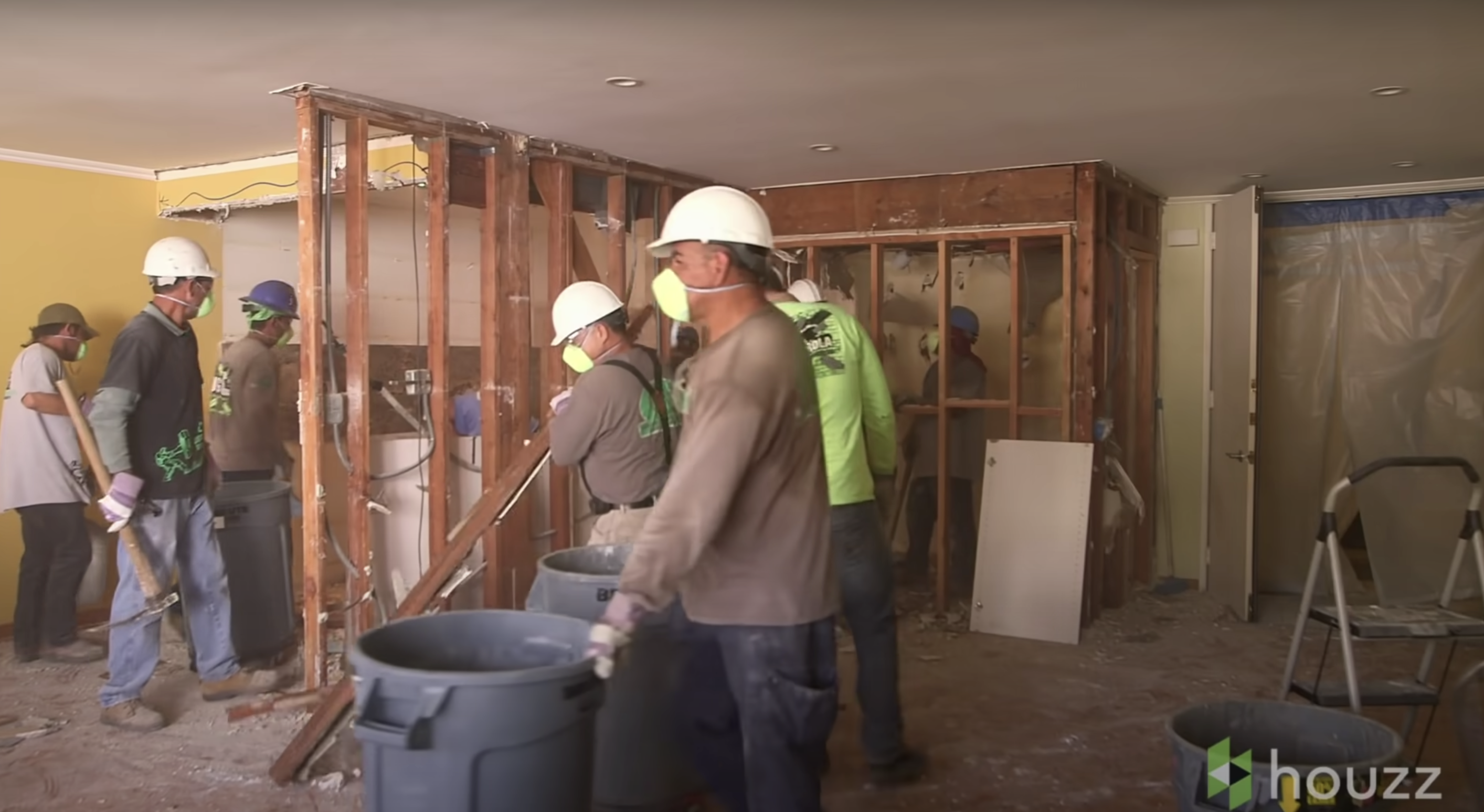 Men working on renovating Mila Kunis' parents' condo | Source: Youtube.com/HouzzTV