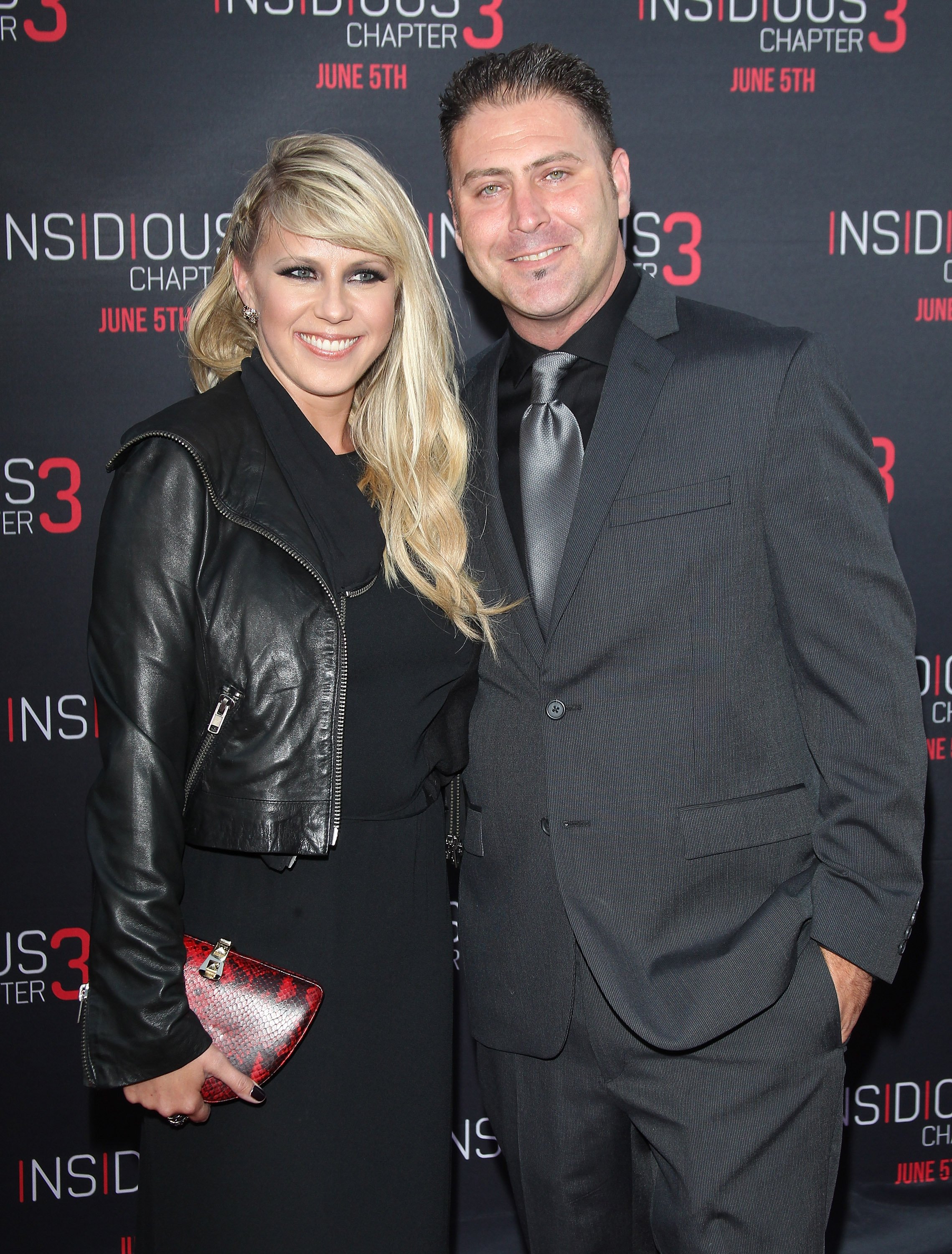 Jodie Sweetin and Justin Hodak arriving at the Los Angeles premiere of "Insidious: Chapter 3" at TCL Chinese Theatre IMAX on June 4, 2015 in Hollywood, California.┃Source: Getty Images