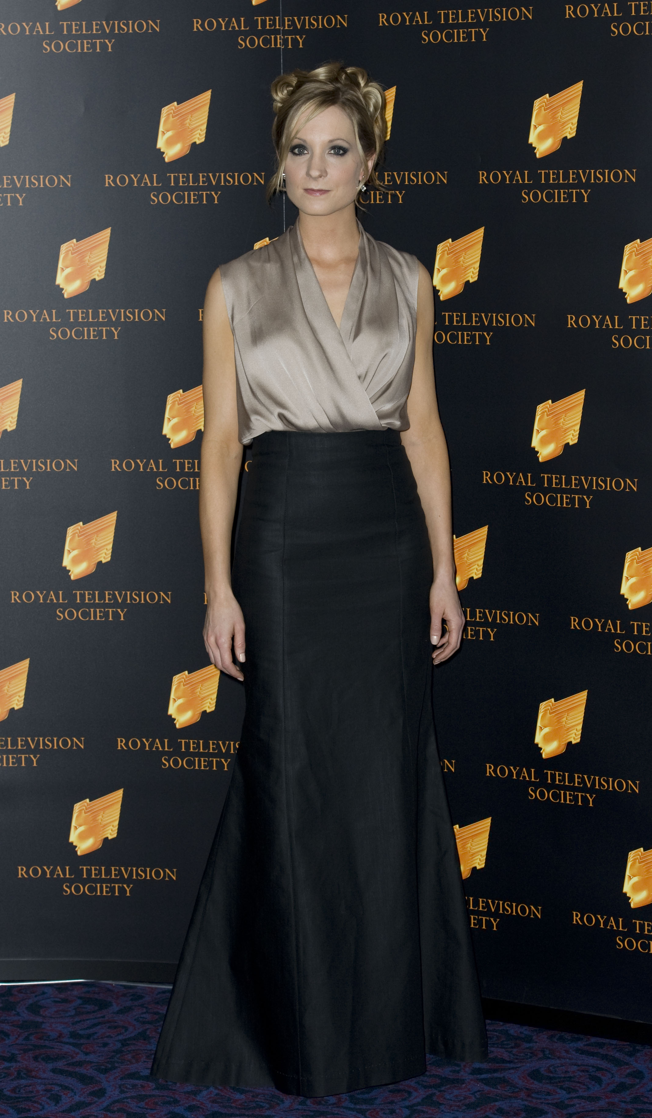Joanne Froggatt arrived at the RTS Programme Awards in 2010 with an elegant updo and smoky eye makeup, wearing a taupe wrap top and high-waisted black skirt. Her red carpet look had a soft glamour that subtly echoed her role as the quietly resilient Anna Bates on "Downton Abbey."