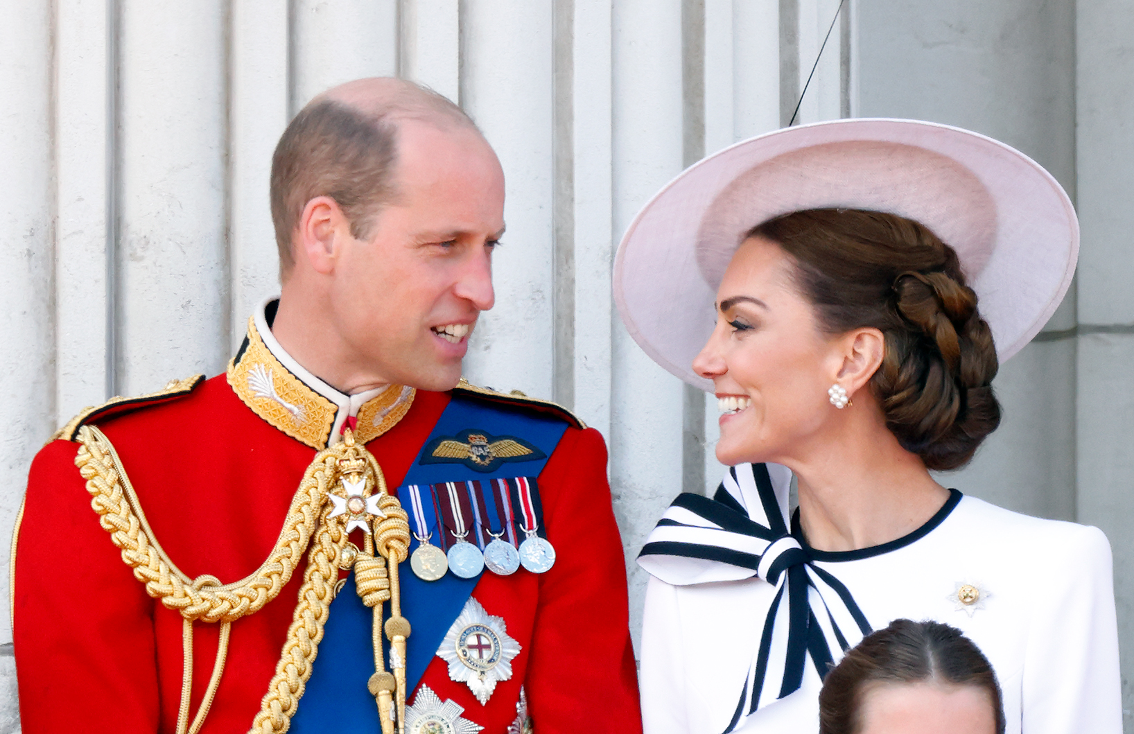Prince William looks at Princess Catherine as they observe the Royal Air Force flypast from the balcony of Buckingham Palace in London on June 15, 2024. | Source: Getty Images