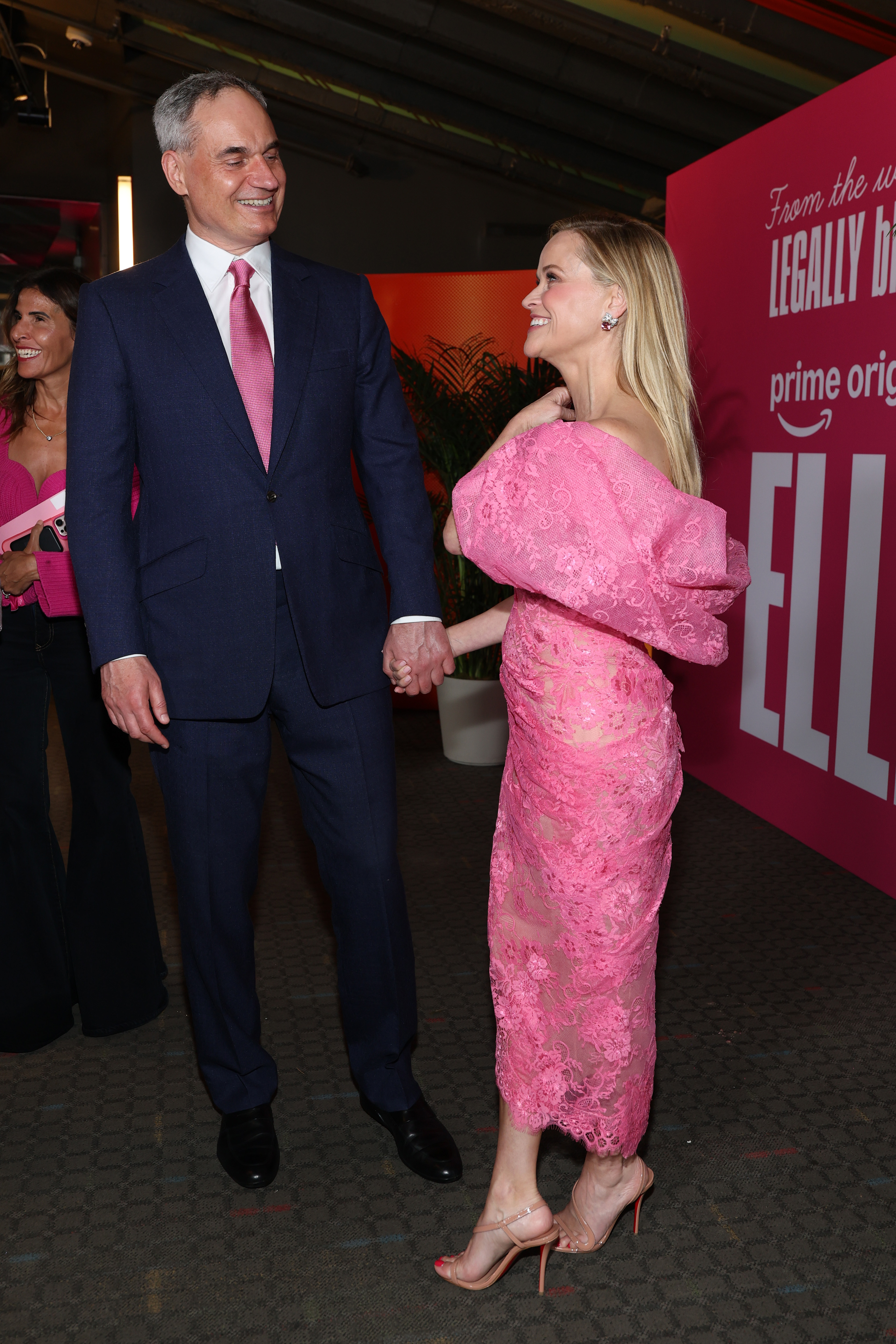 Witherspoon's bold pink look added a playful nod to the "Elle" universe, while Haarmann's coordinating tie made their outing feel intentionally polished. It was the kind of detail fans immediately noticed — and debated. | Source: Getty Images