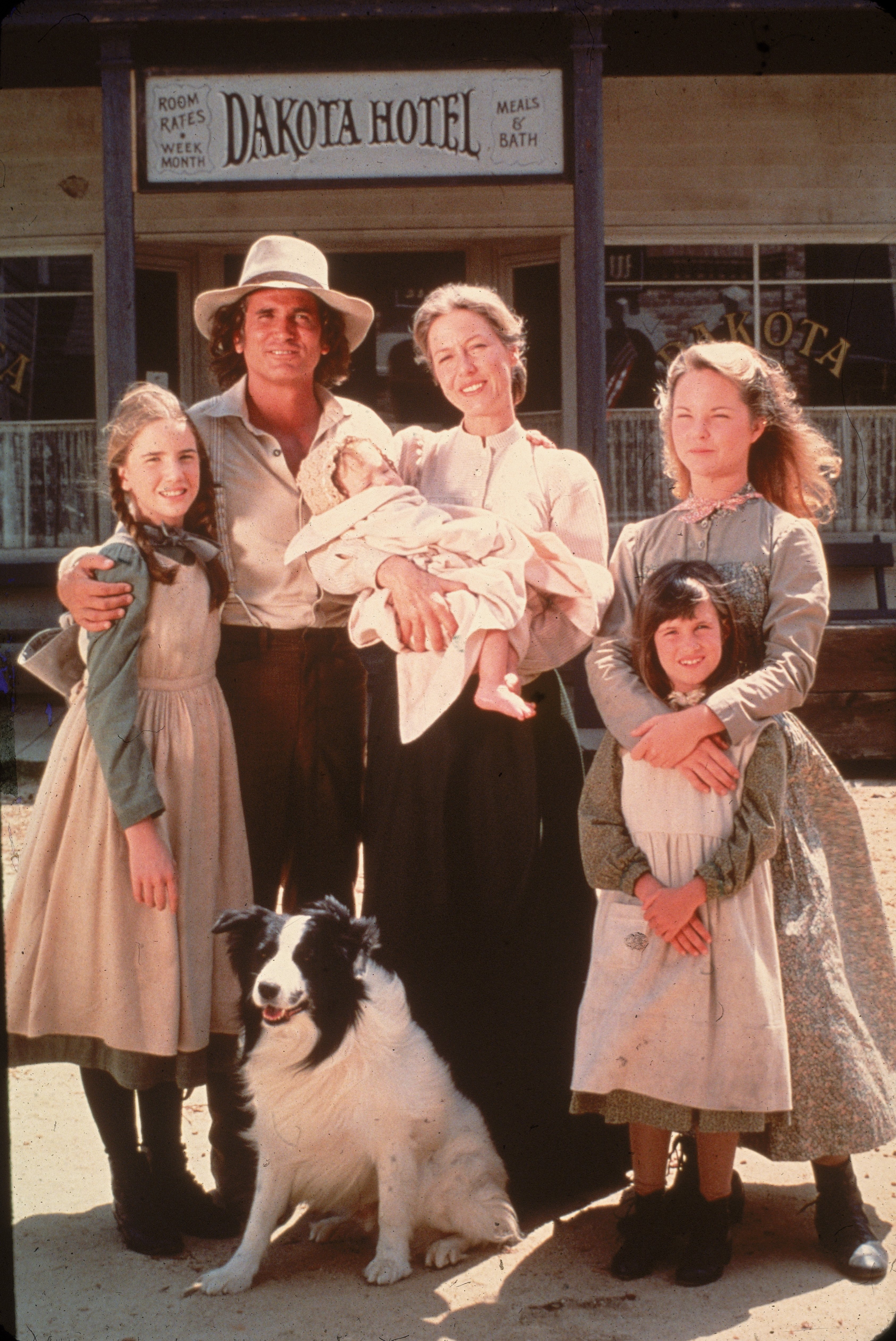 The cast of the television series "Little House on the Prairie" with a dog on the set of the show, mid 1970s | Photo: Getty Images