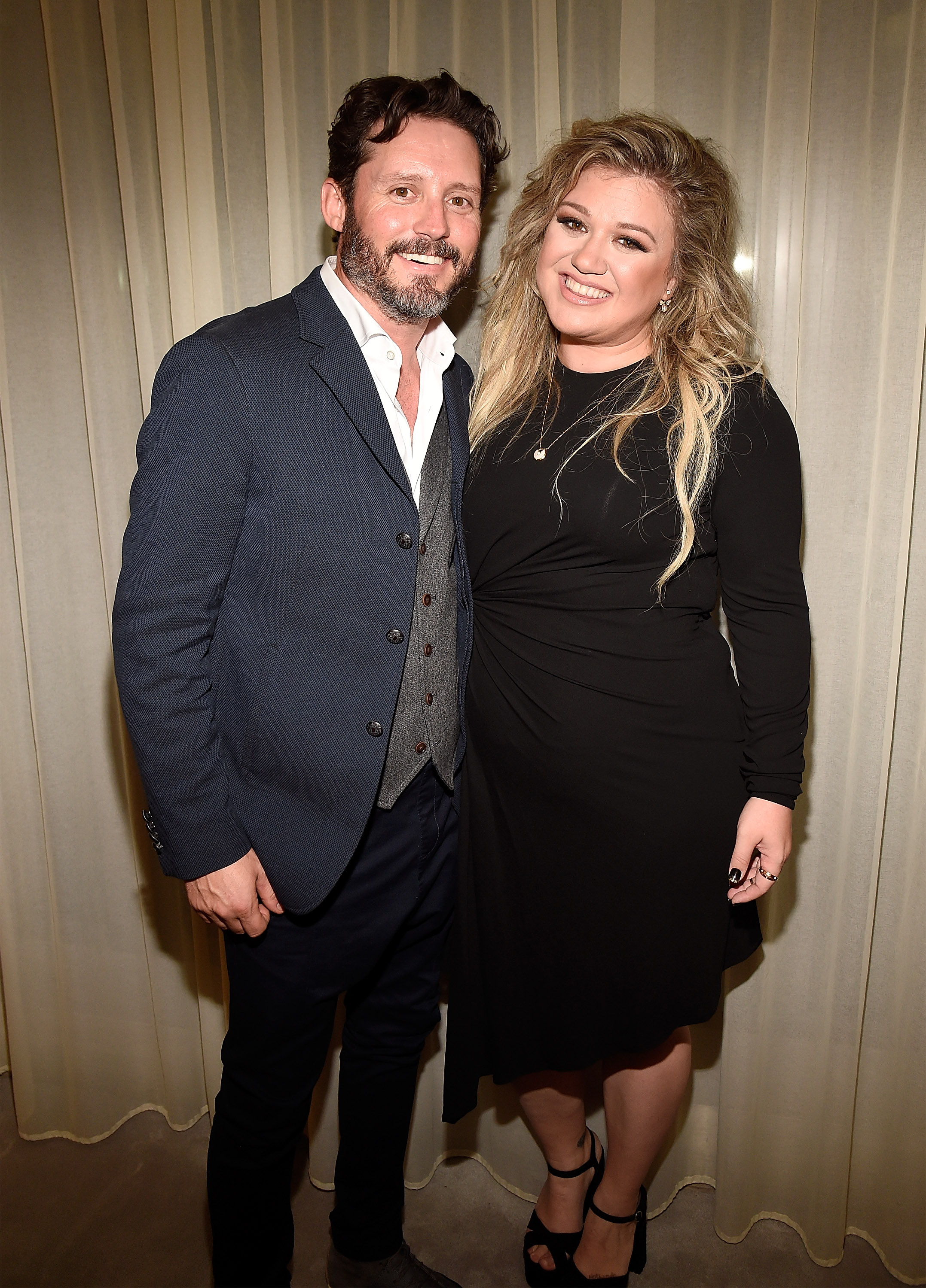 Brandon Blackstock and Kelly Clarkson backstage after she performed songs from her album "The Meaning of Life" at The Rainbow Room on September 6, 2017, in New York. | Source: Getty Images
