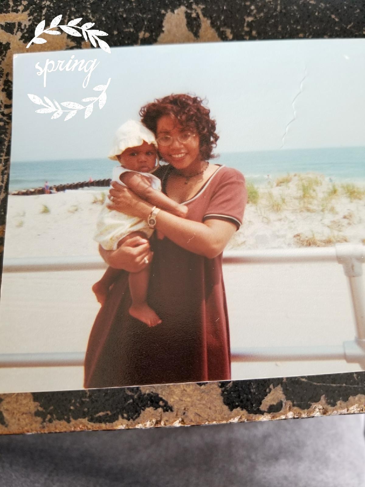 Monica Morris with one of her children at a beach | Source: GoFundMe