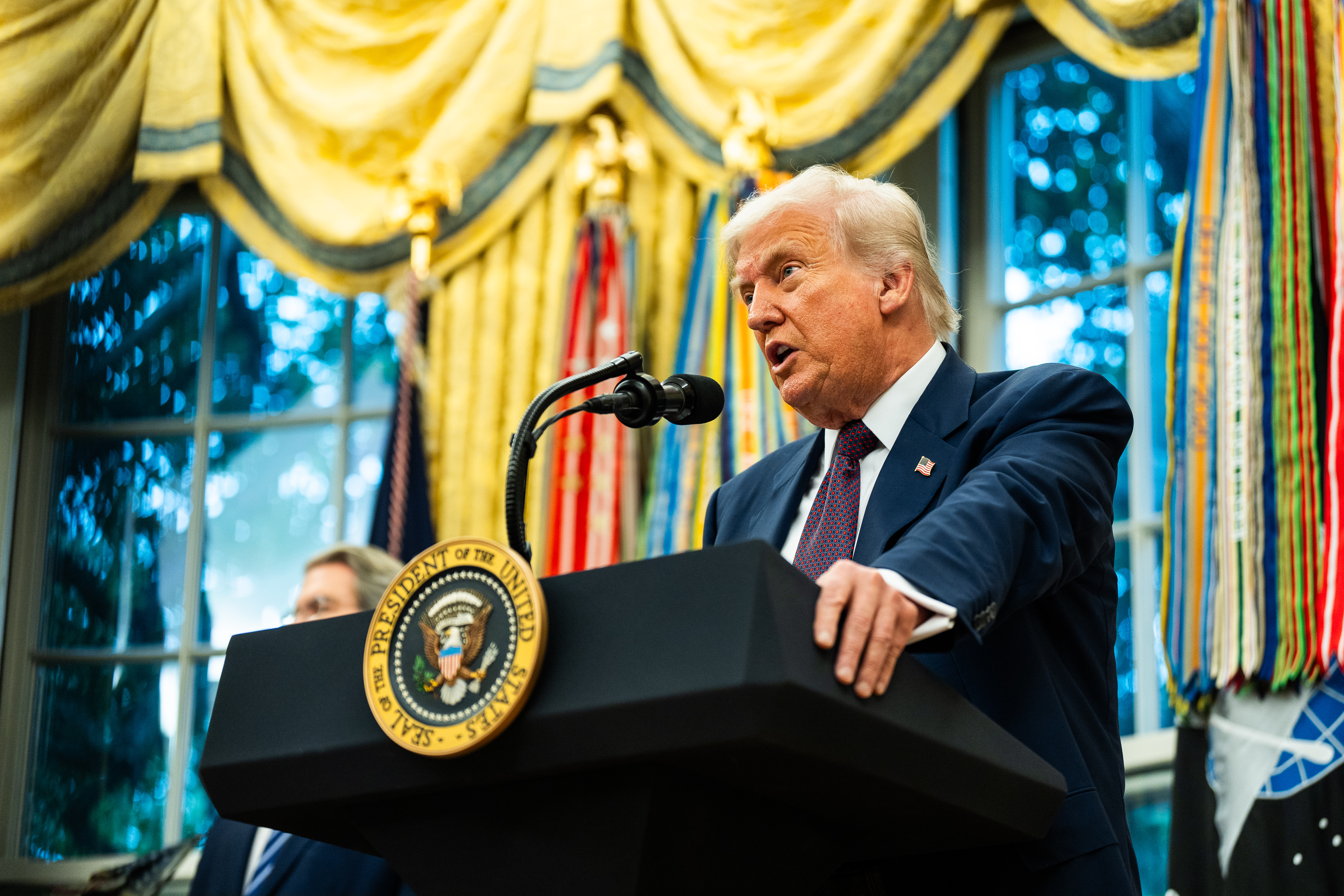 US President Donald Trump speaks during a meeting with Apple CEO Tim Cook at the White House on August 6, 2025 | Source: Getty Images