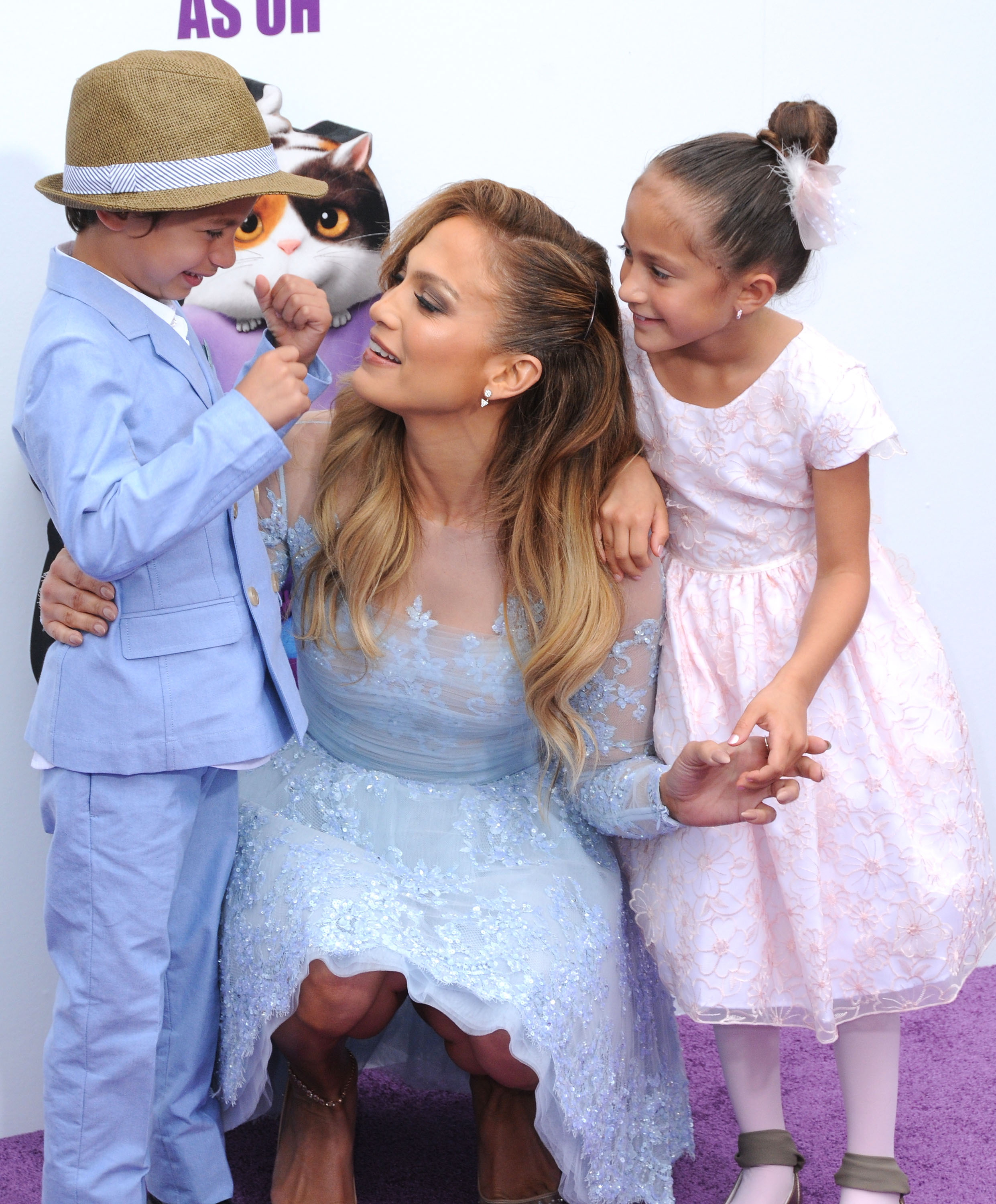 Recording artist/actress Jennifer Lopez (C) and her son Maximillian David Muniz (L) and daughter Emme Maribel Muniz (R) arrive at Twentieth Century Fox And Dreamworks Animation's 'Home' Premiere at Regency Village Theatre on March 22, 2015 in Westwood, California | Source: Getty Images
