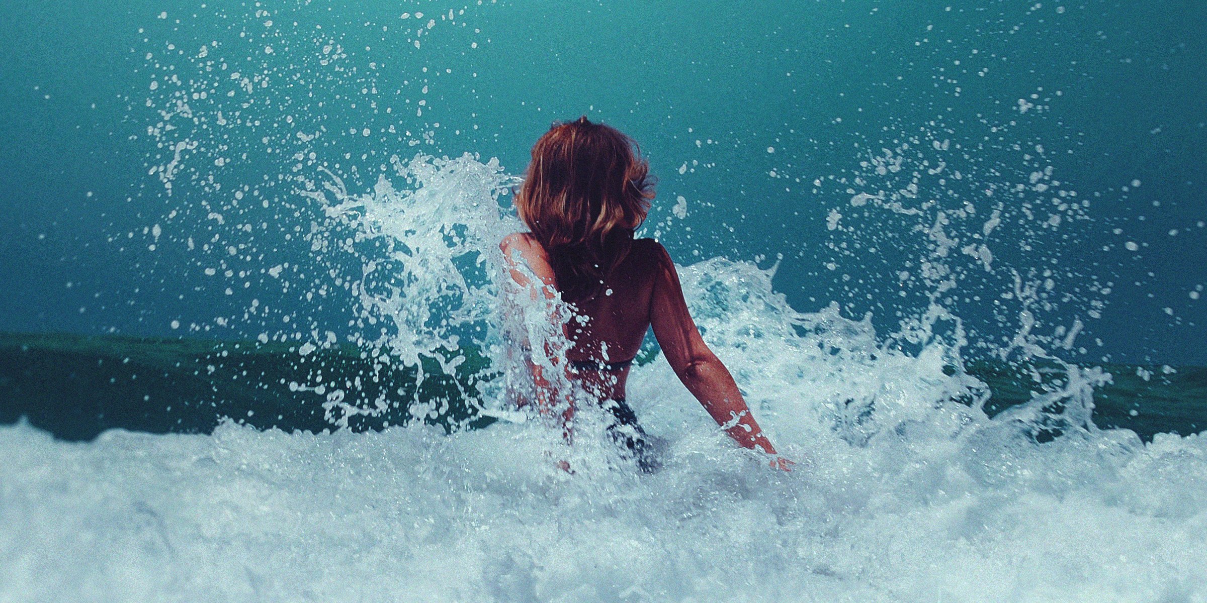 Unsplash | Woman in a rush of water