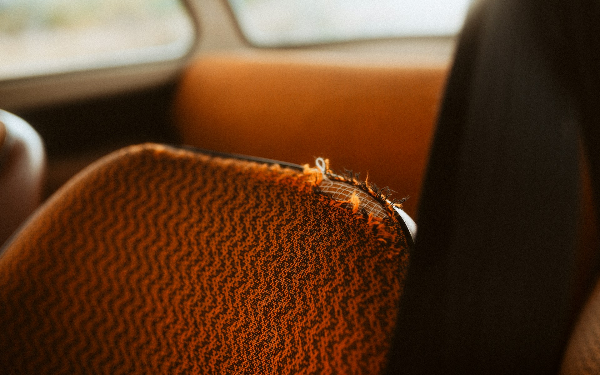 A seat with a worn crocheted cover | Source: Unsplash