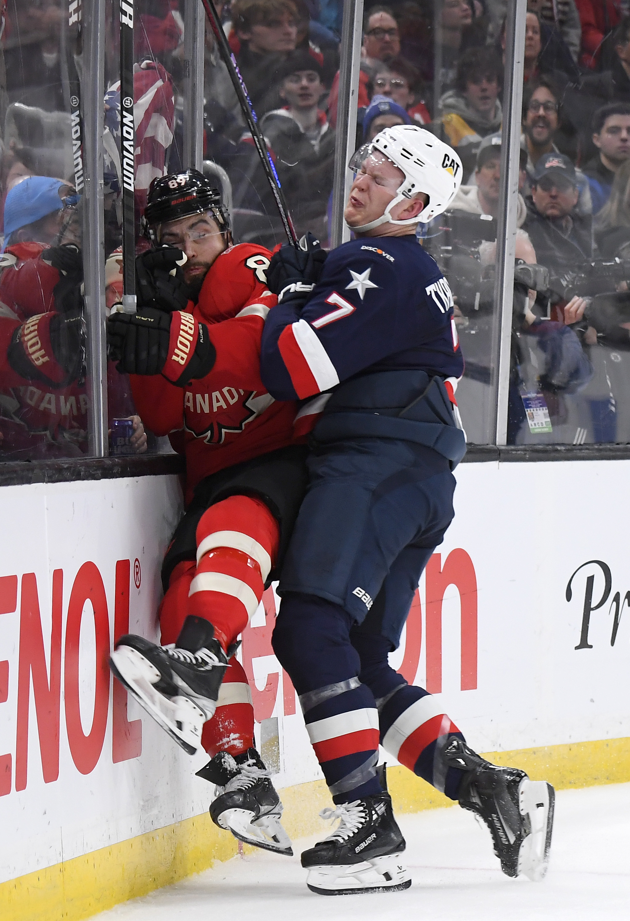 Brady Tkachuk, #7 of Team United States, checks Drew Doughty, #89 of Team Canada, into the end boards during the second period on February 20, 2025 | Source: Getty Images