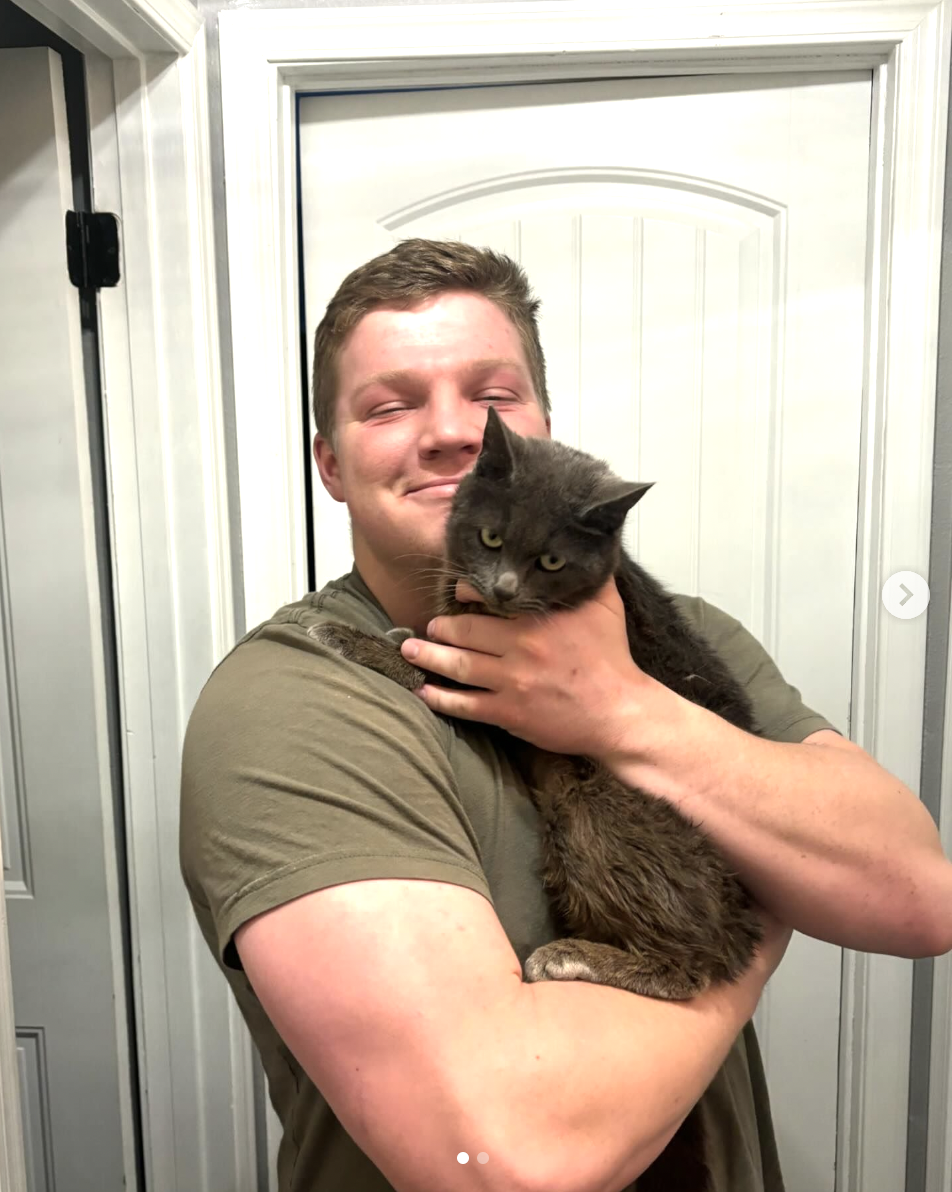 Garrison Brown hugging one of his cats in his final social media upload, dated February 29, 2024 | Source: instagram/robertthebrown