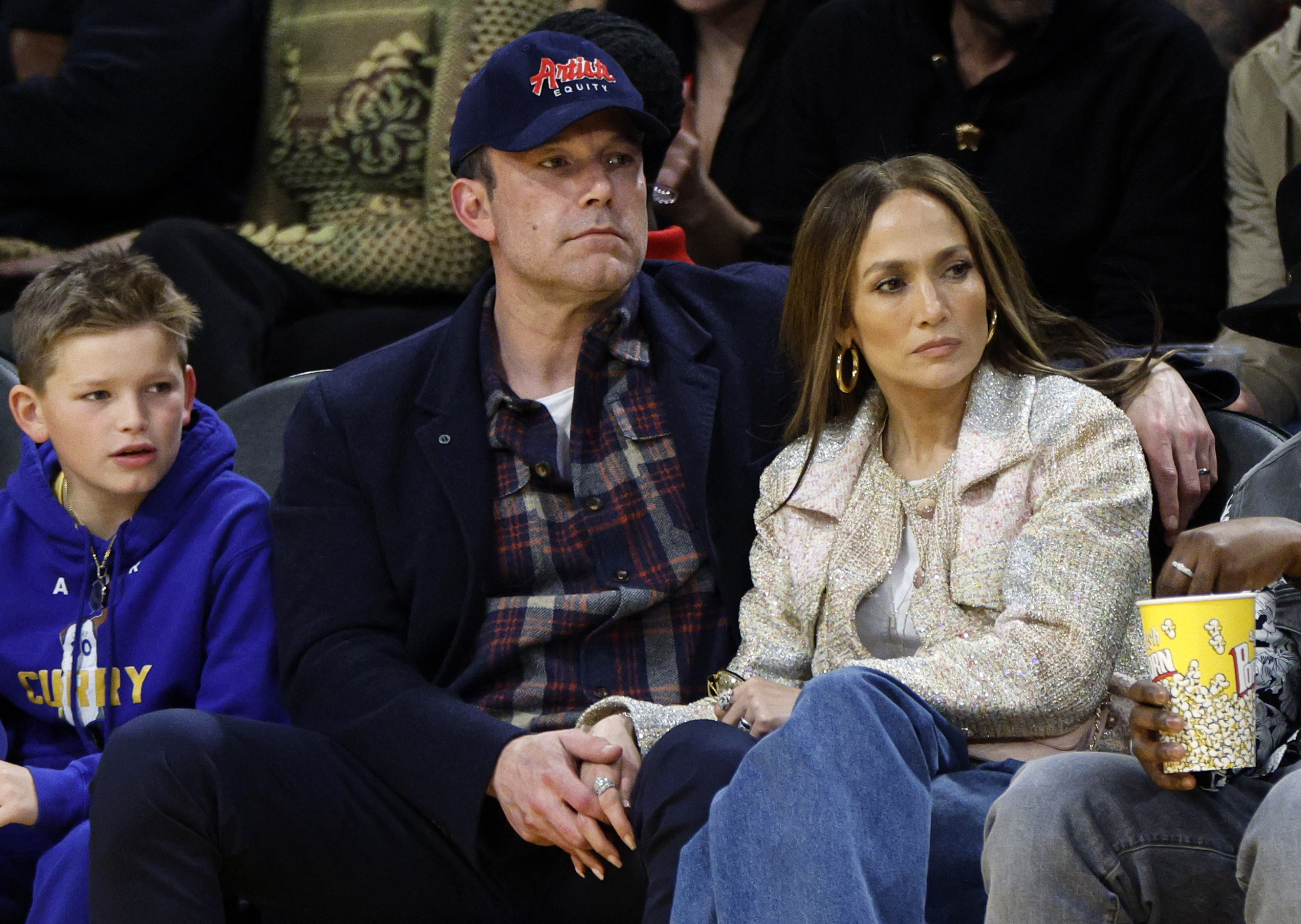 Samuel Garner Affleck, Ben Affleck and Jennifer Lopez watch the basketball game between the Los Angeles Lakers and Golden State Warriors at Crypto.com Arena on March 16, 2024, in Los Angeles, California. | Source: Getty Images