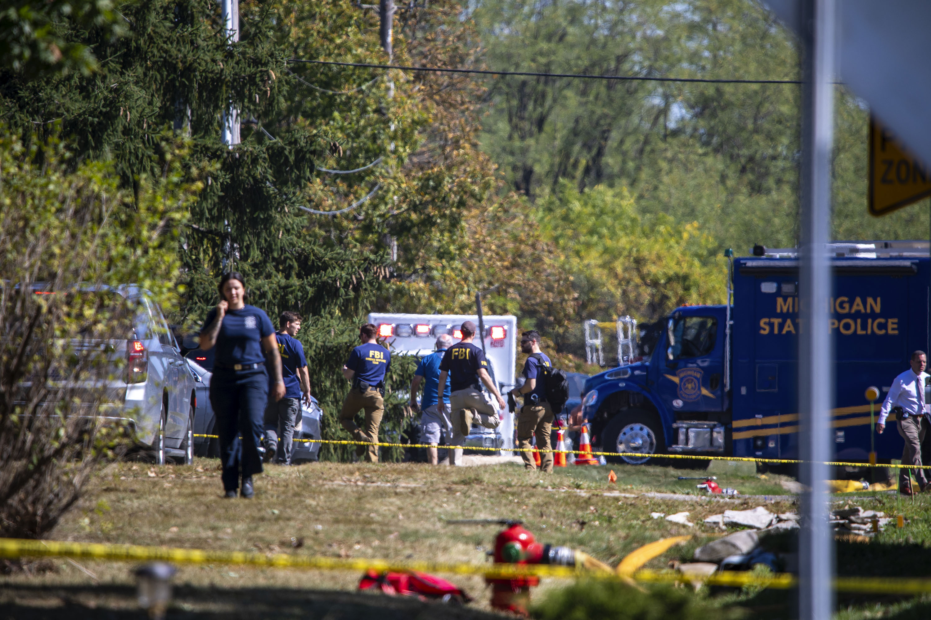 Emergency personnel, including FBI agents and Michigan State Police, respond to a church shooting and fire in Grand Blanc, Michigan, on September 28, 2025 | Source: Getty Images