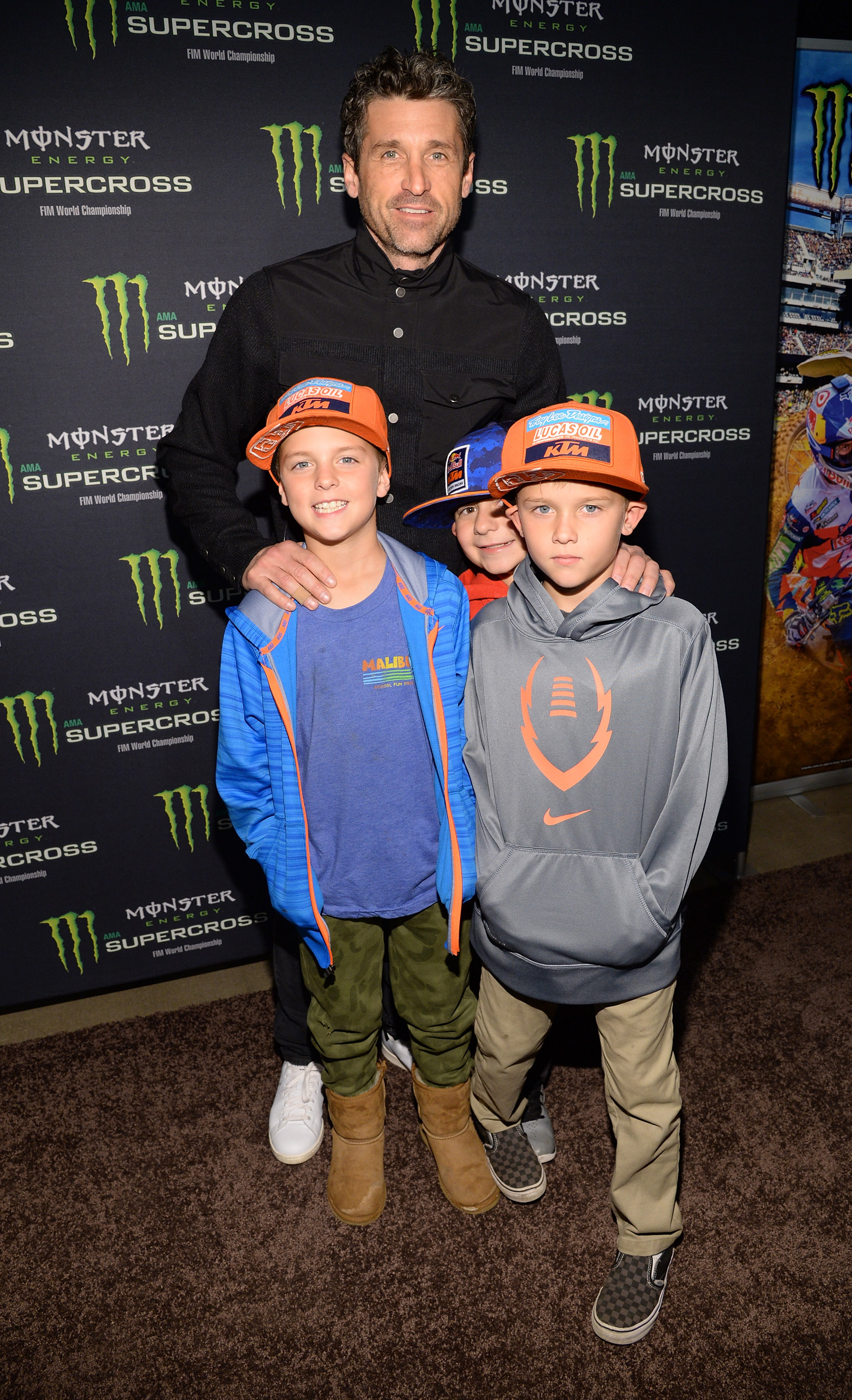 Patrick, Darby and Sullivan Dempsey at the Monster Energy Supercross Celebrity Night in Anaheim, California on January 23, 2016 | Source: Getty Images