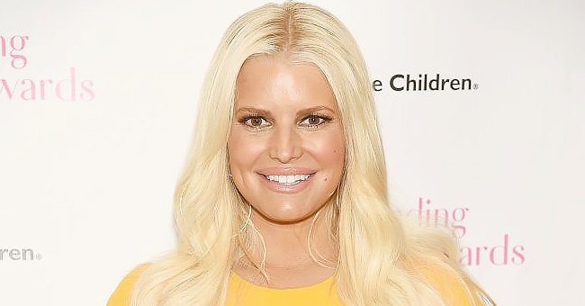 Jessica Simpson Poses for Steamy Photo in a Swimsuit in Front of a ...