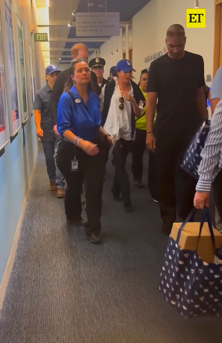 Prince Harry and Meghan Markle walking through Dodger Stadium, surrounded by security personnel, posted on October 29, 2025. | Source: Instagram/entertainmenttonight