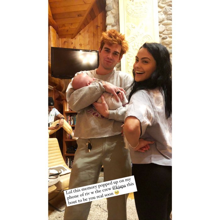 KJ Apa and Camila Mendes posing with Vanessa Morgan's baby | Photo: Instagram Stories/vanessamorgan