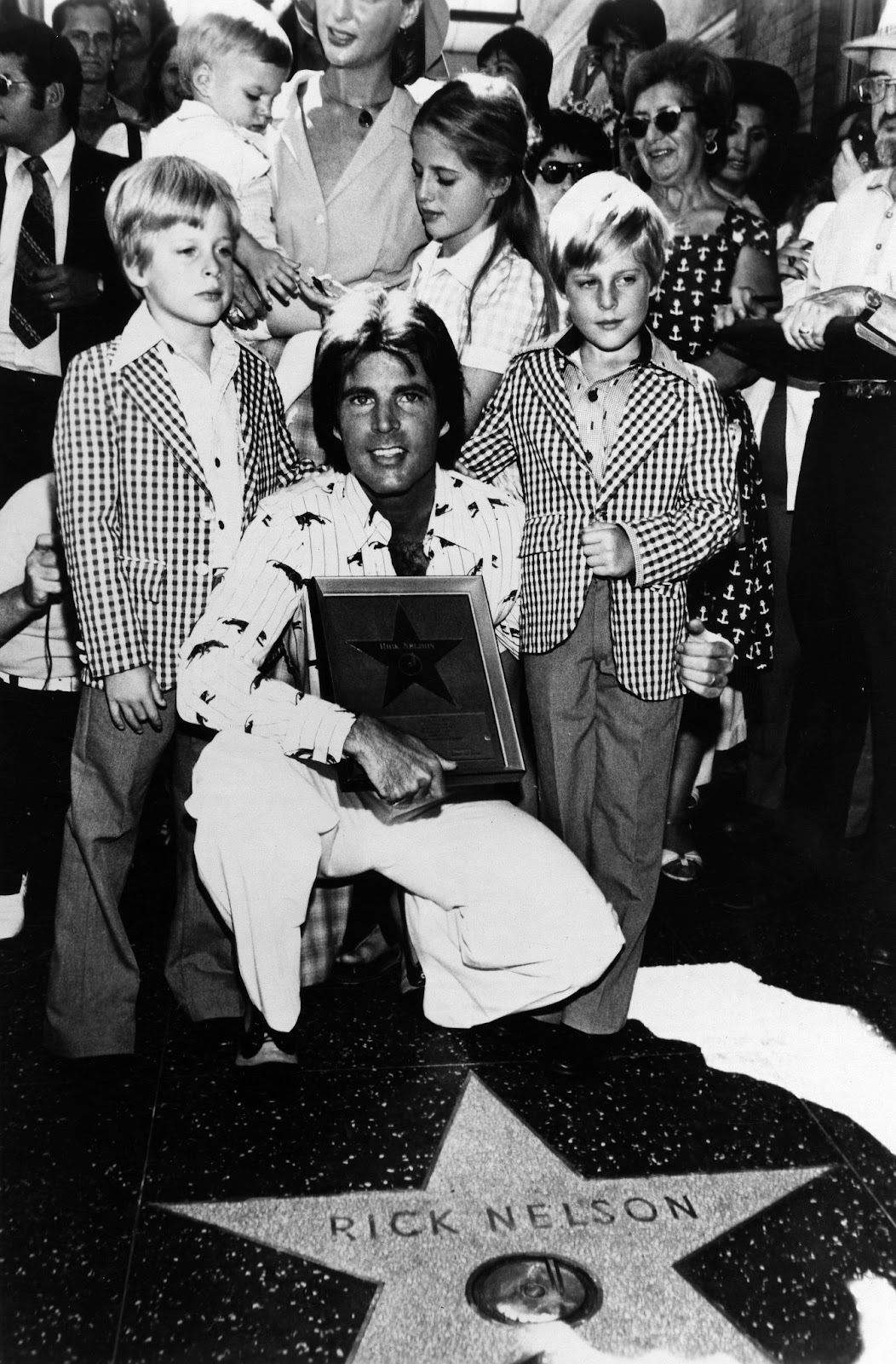 Ricky Nelson with his sons Gunnar and Matthew Nelson while getting his star on the Hollywood Walk of Fame on September 17, 1975. | Source: Getty Images