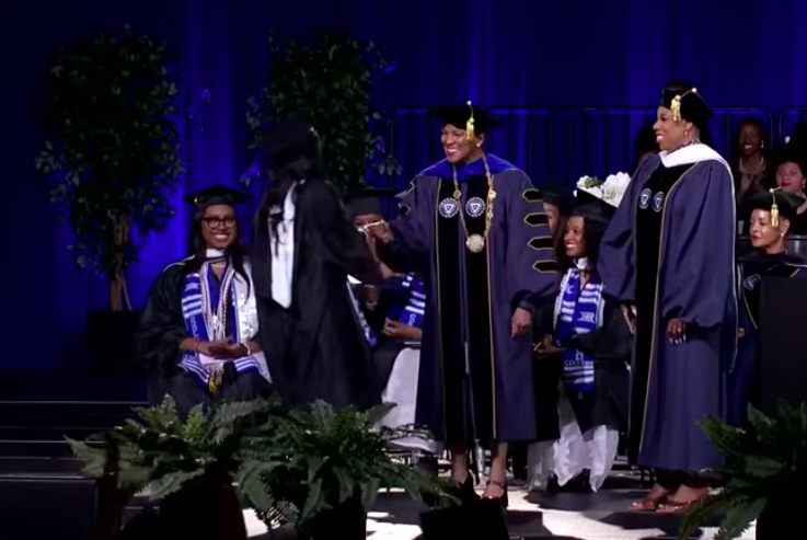 Zahara Marley Jolie shaking hands with people as her name was called during the Spelman College's 2026 Commencement Ceremony, posted on May 17, 2026. | Source: YouTube/Spelman College