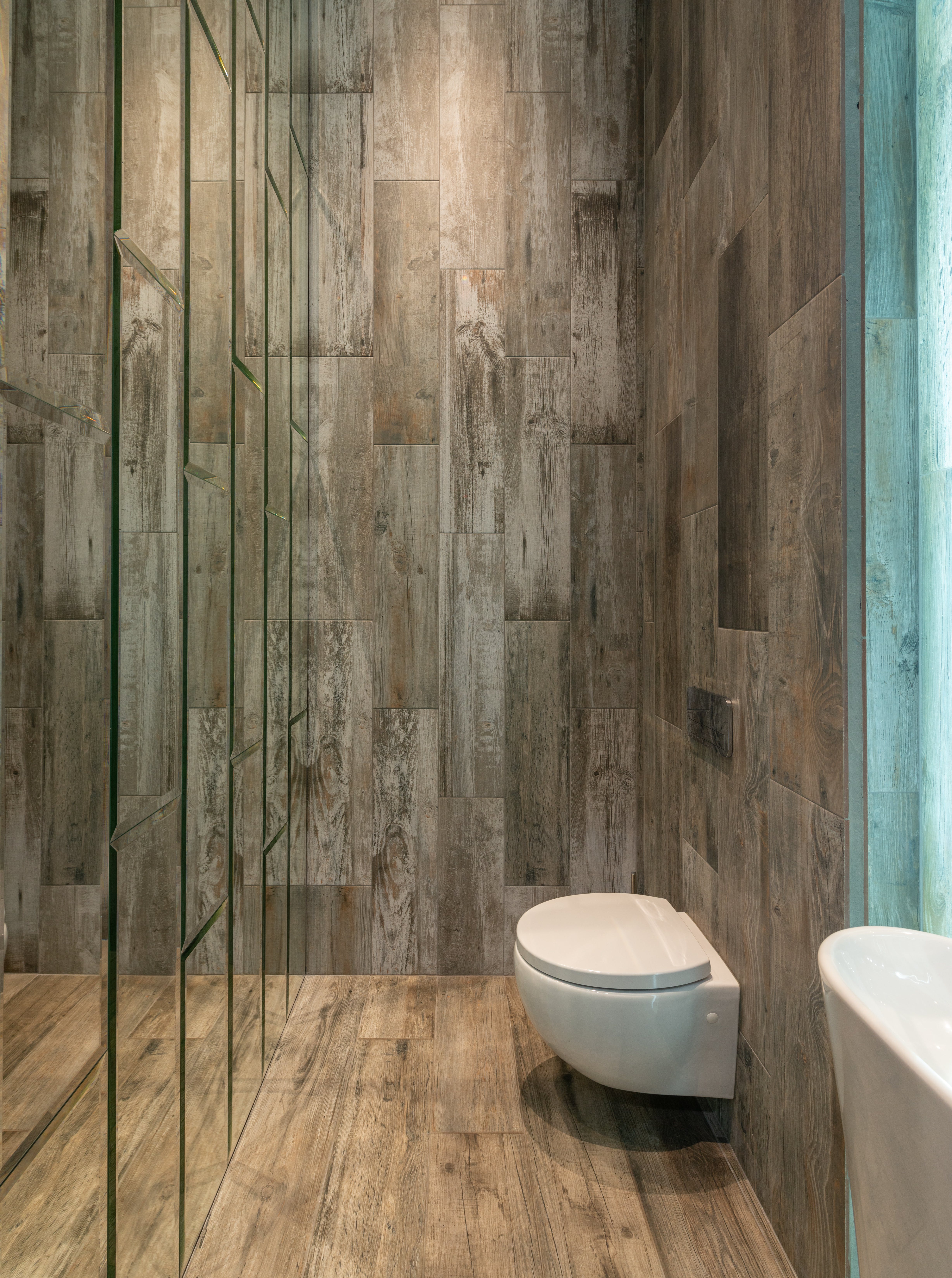 Modern bathroom with wooden panels on the walls. | Source: Pexels