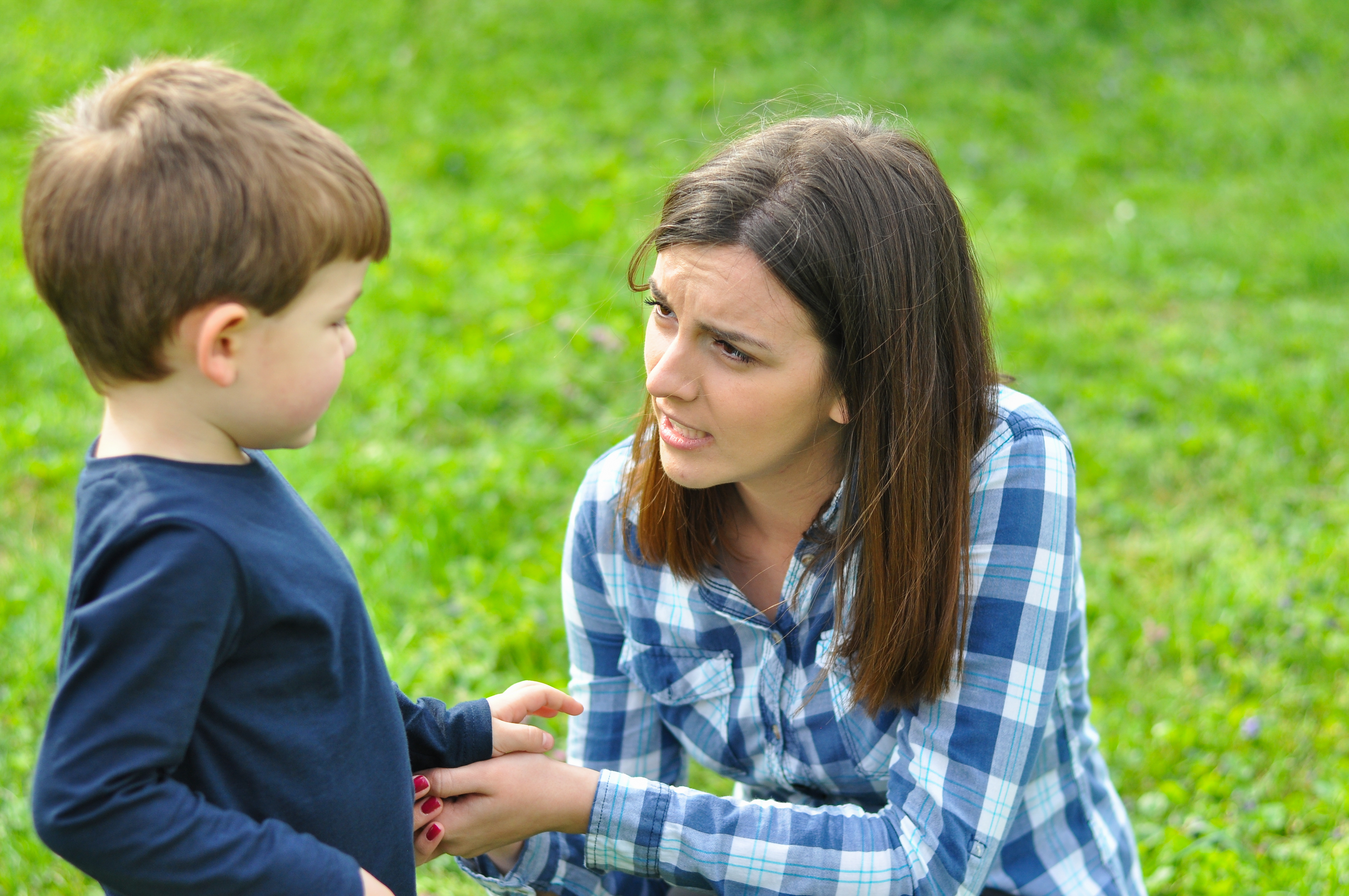 A woman talking to a child | Source: Shutterstock