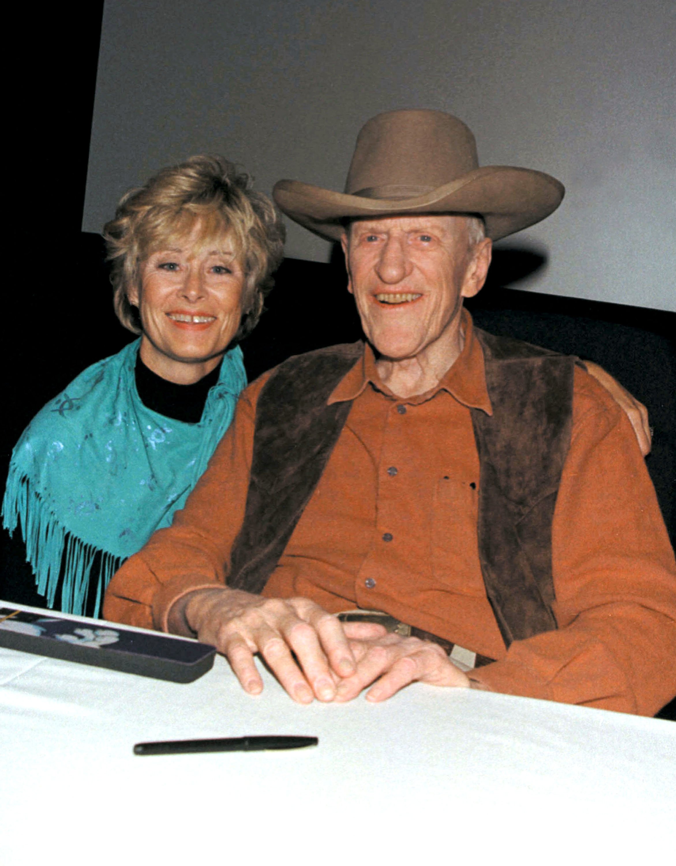  James Arness poses with his wife Janet during a signing of his new book "James Arness: An Autobiography" at the Gene Autry Museum November 3, 2001 | Source: Getty Images