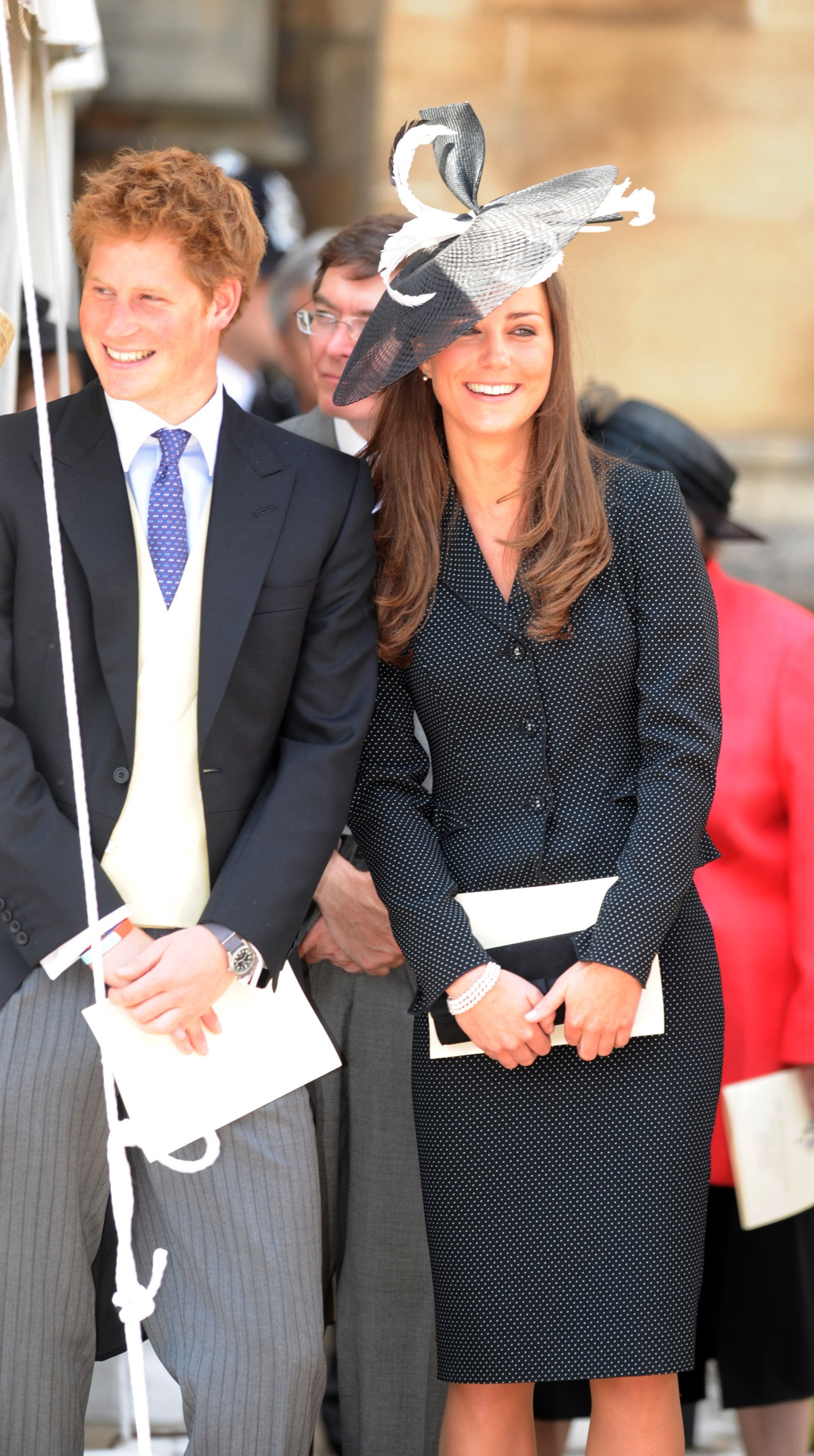 Prince Harry and Prince William's girlfriend Kate Middleton laugh together as they watch the Order of the Garter procession at Windsor Castle on June 16, 2008 in Windsor, England | Source: Getty Images