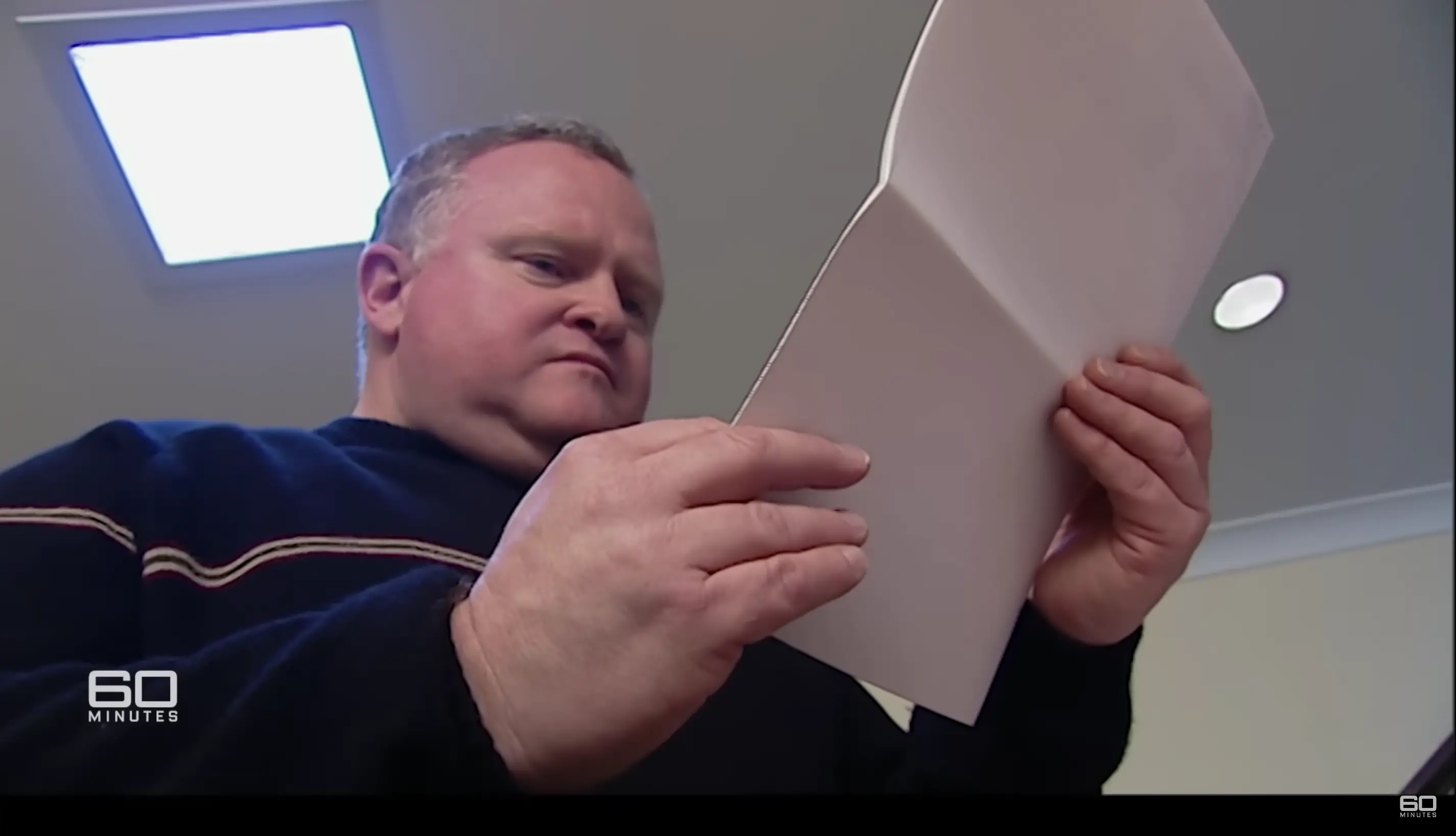 Chris reading the results of the DNA test. | Source: YouTube.com/60 Minutes Australia