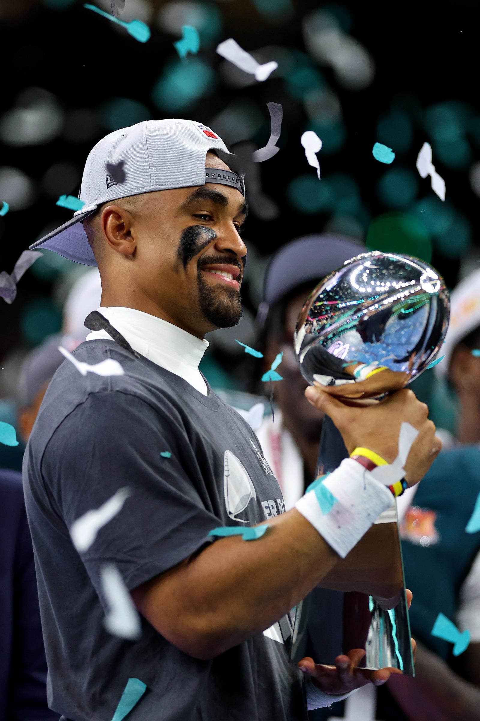 Jalen Hurts celebrating the Eagles' win with the trophy. | Source: Getty Images