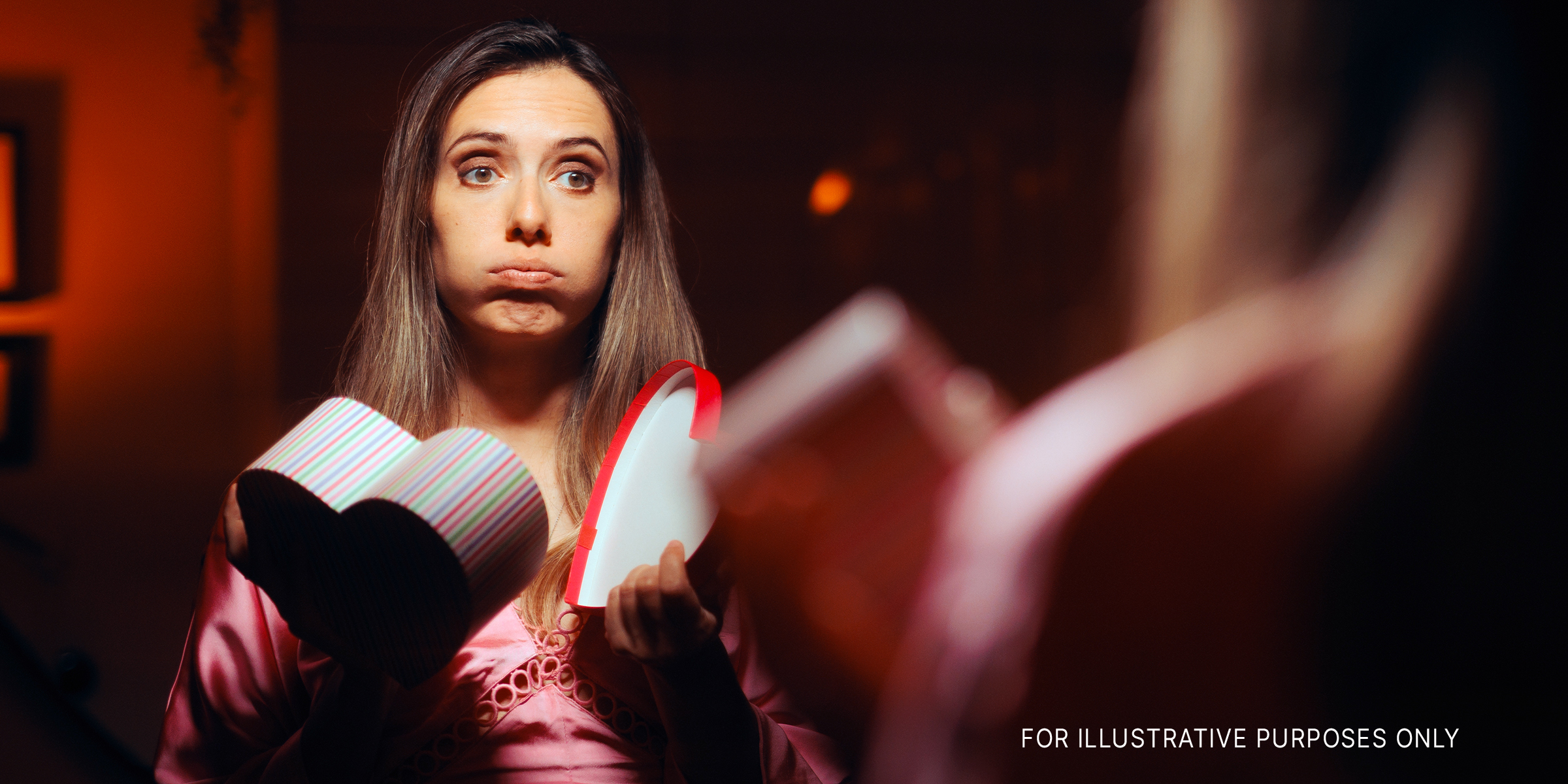 Woman unimpressed with her Valentine's Day gift | Source: Getty Images